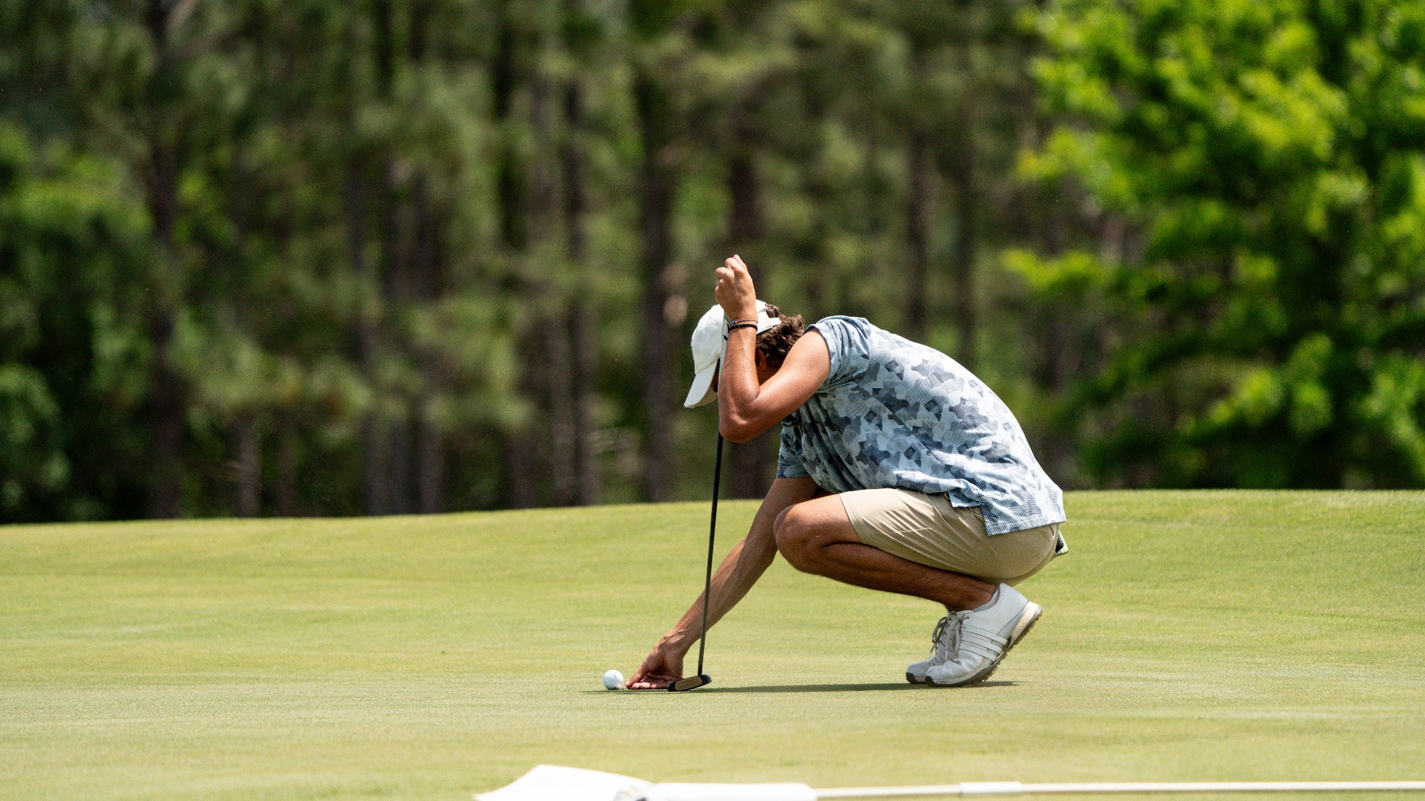 Thomas Romani lines up a putt at the ASUN Championships.