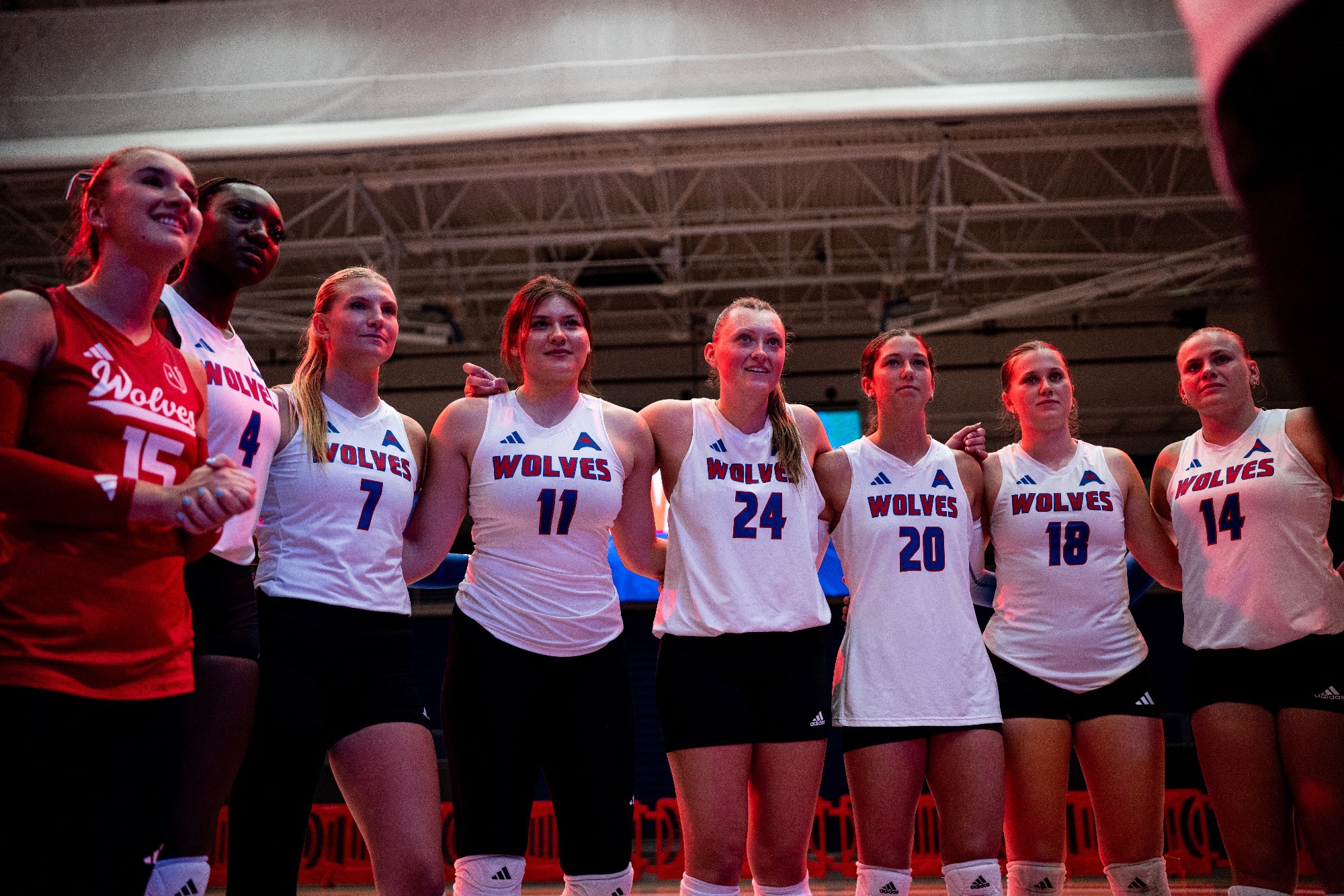 Volleyball team shot with red lights