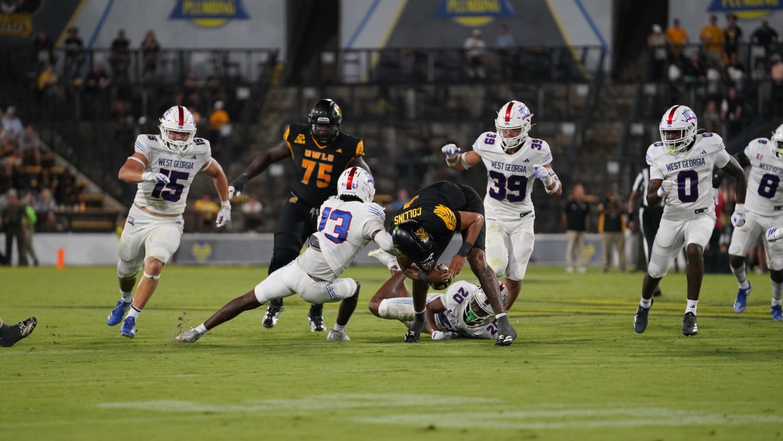 A tackle by Shawn Cummings forces a fumble int he Wolves' loss to KSU.
