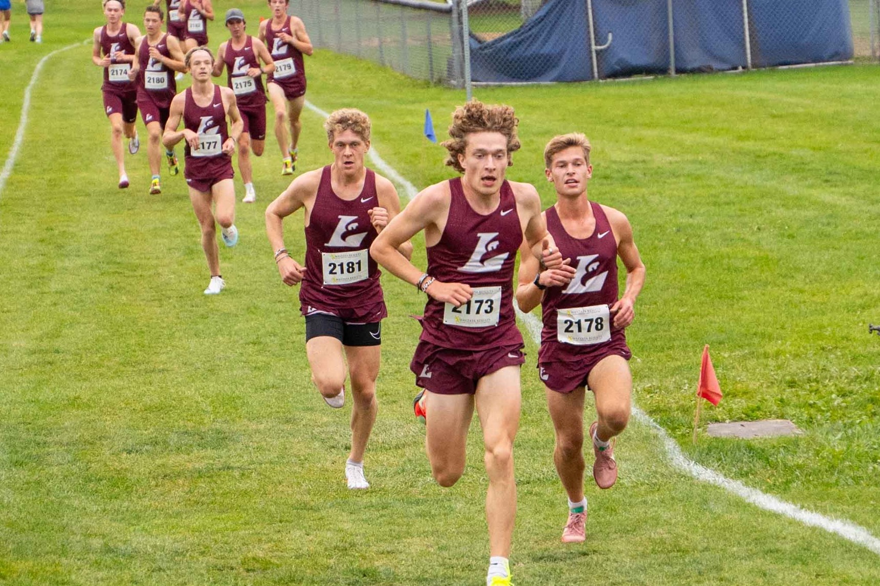 Men's Cross Country team running in a pack