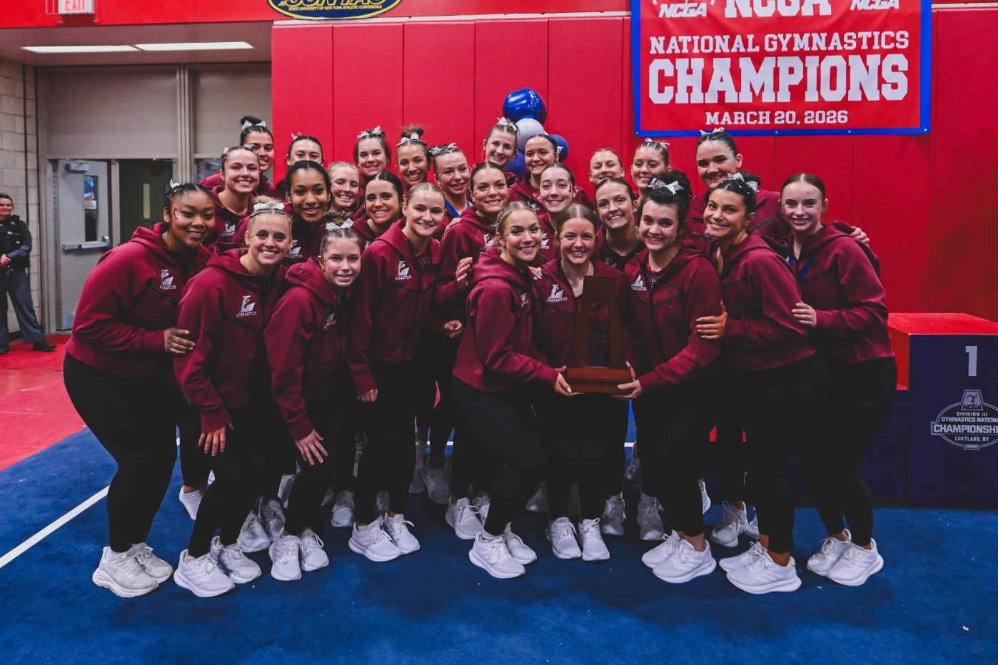 UWL Gymnastics Team Photo With 2nd Place NCGA Trophy