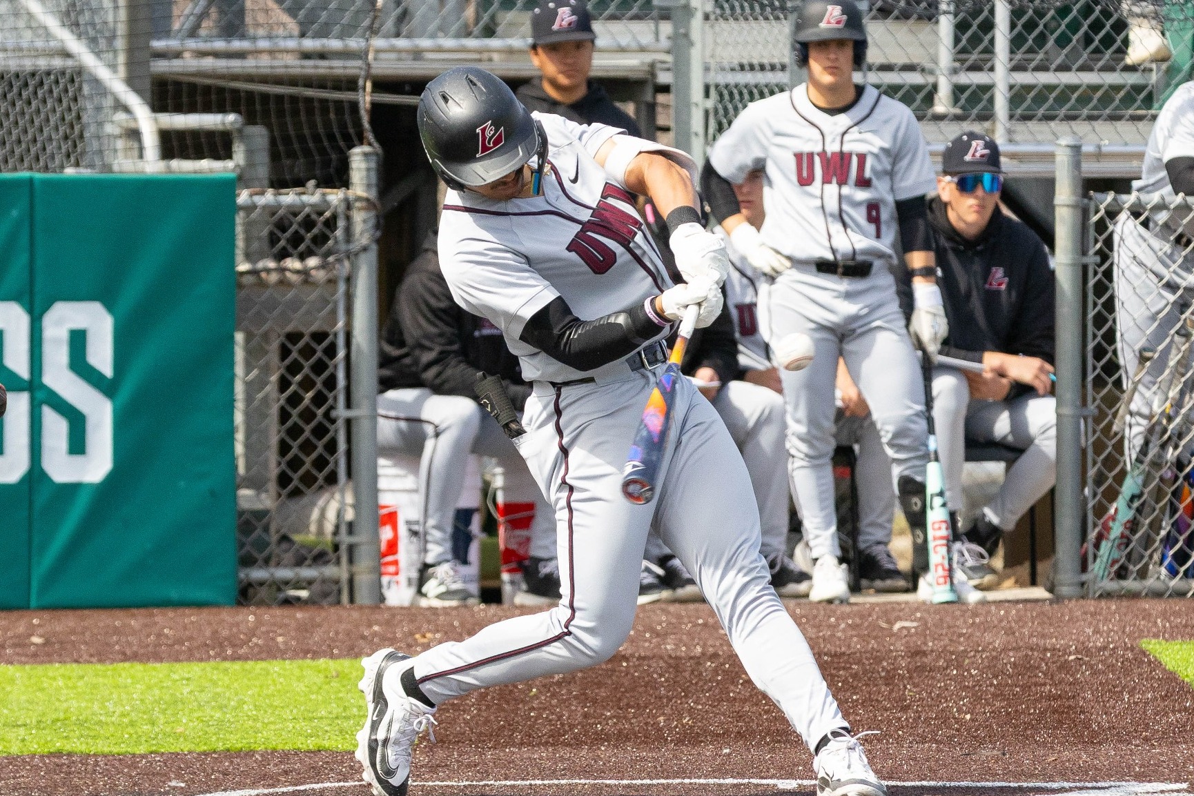 Emiliano Ramos hitting a pitch against UW-River Falls