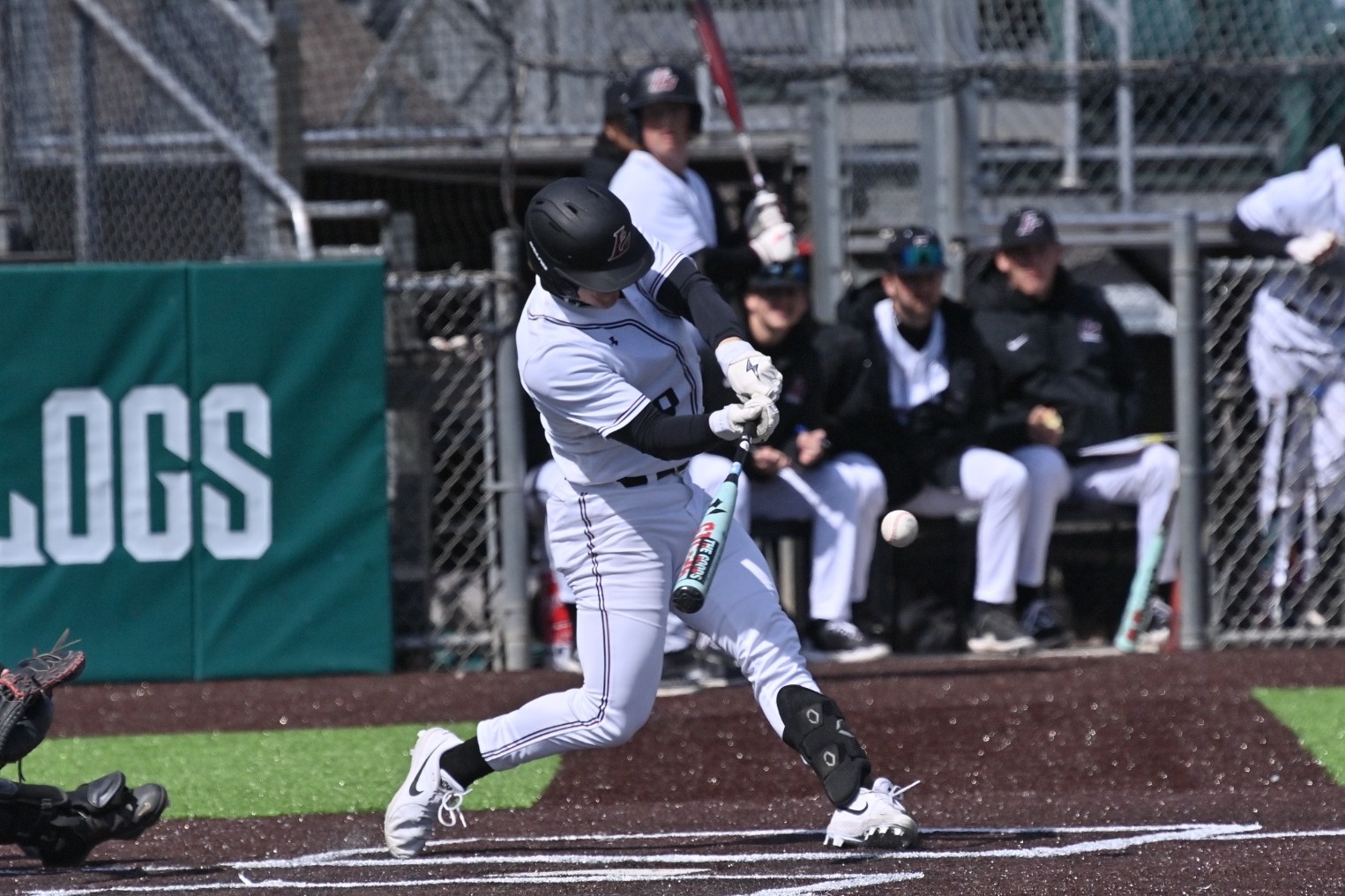 Charley Rowan hitting a baseball