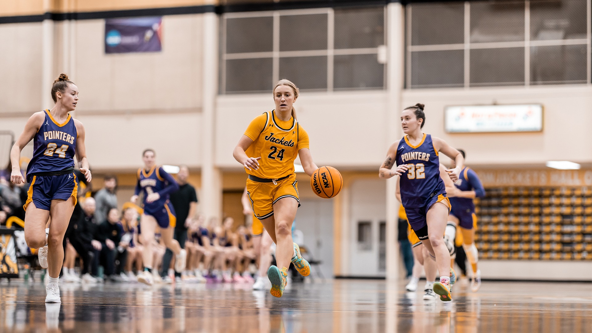 Hope Carlson dribbling down the court versus UW-Stevens Point.