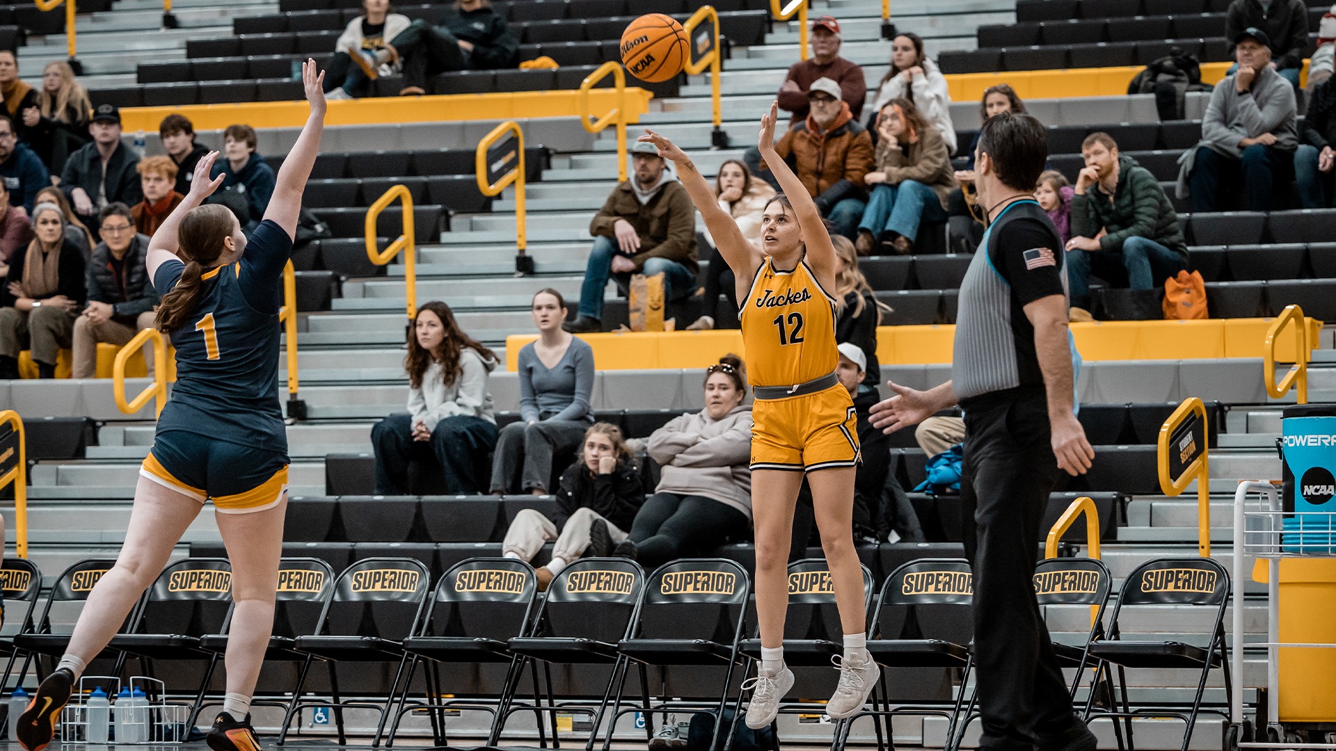 MyKenzie Leccia attempting a three pointer.