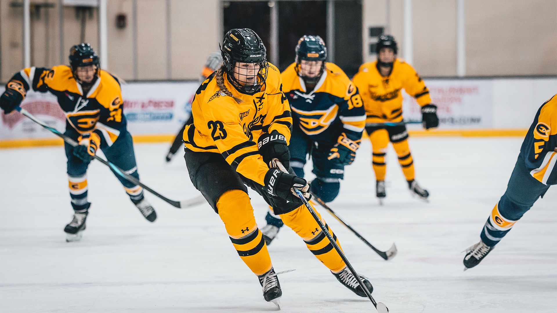 Aylie Dahl skating past a Blugold defender.