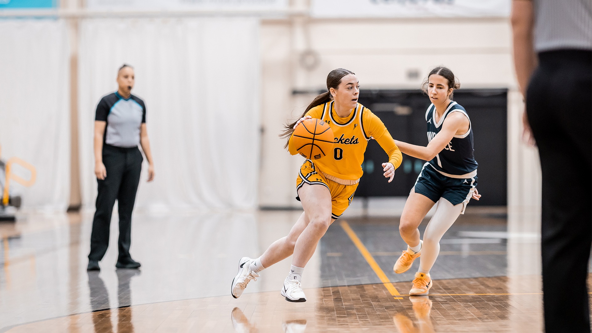 Kyra Latvala moving past a Lawrence defender.