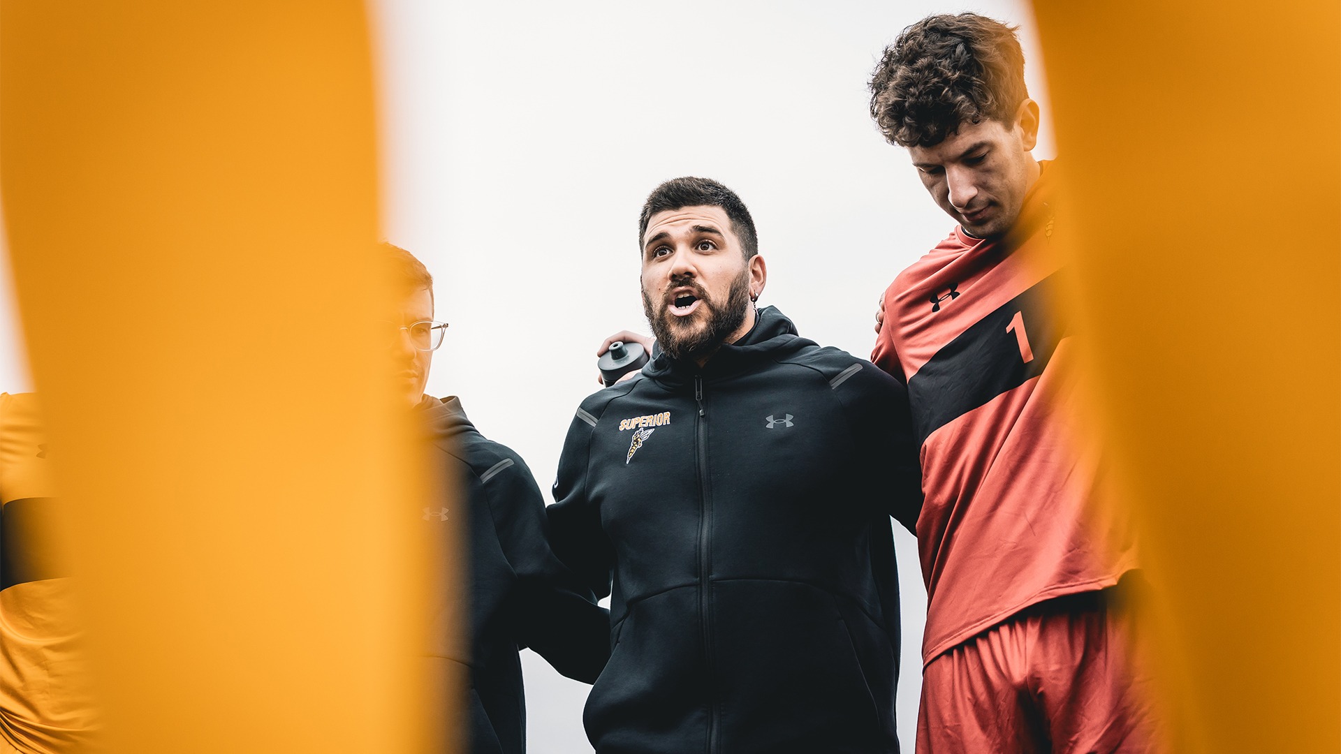 Gus Nascimento speaking to his team.