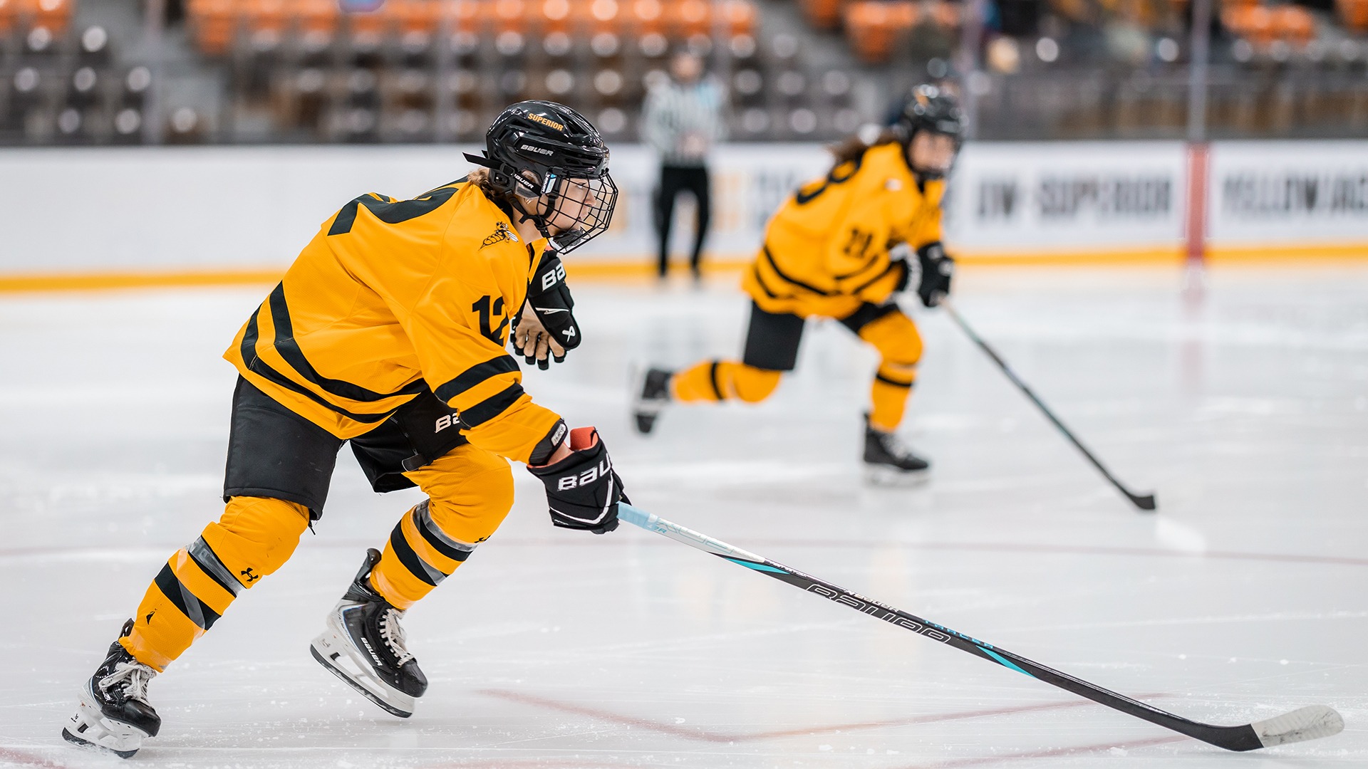 Maya Anderson skates after puck against Bethel. 