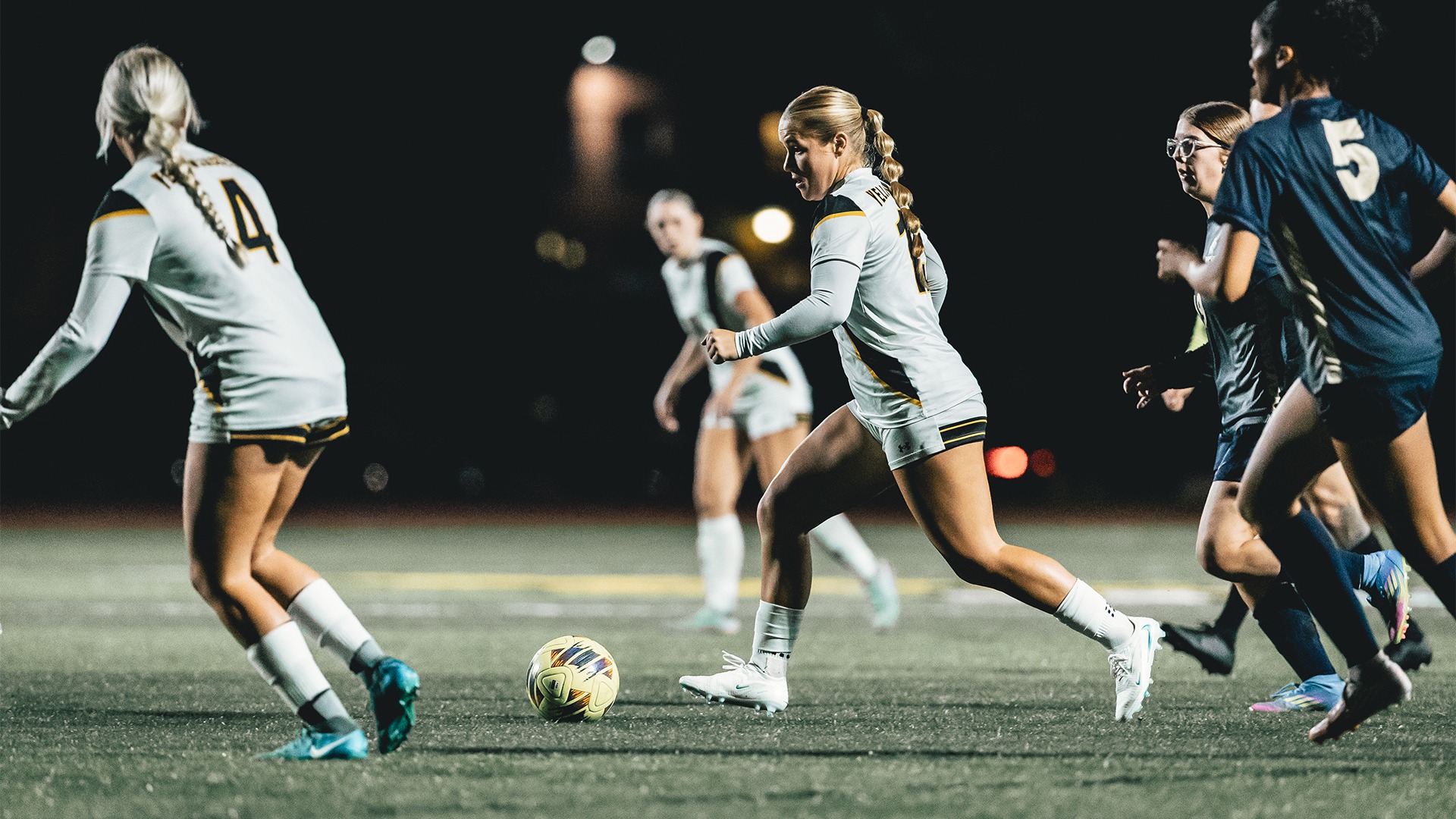 Lilly Breitkreutz dribbling past the opposition.