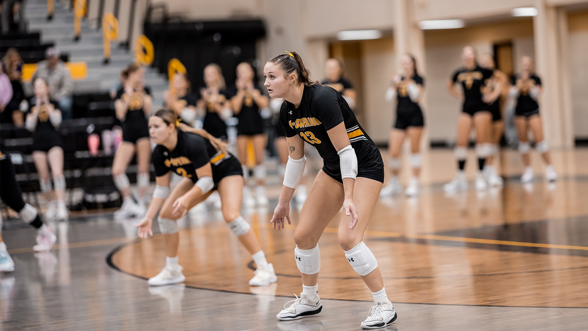 Makenna Hohbein preparing for an opposing serve.