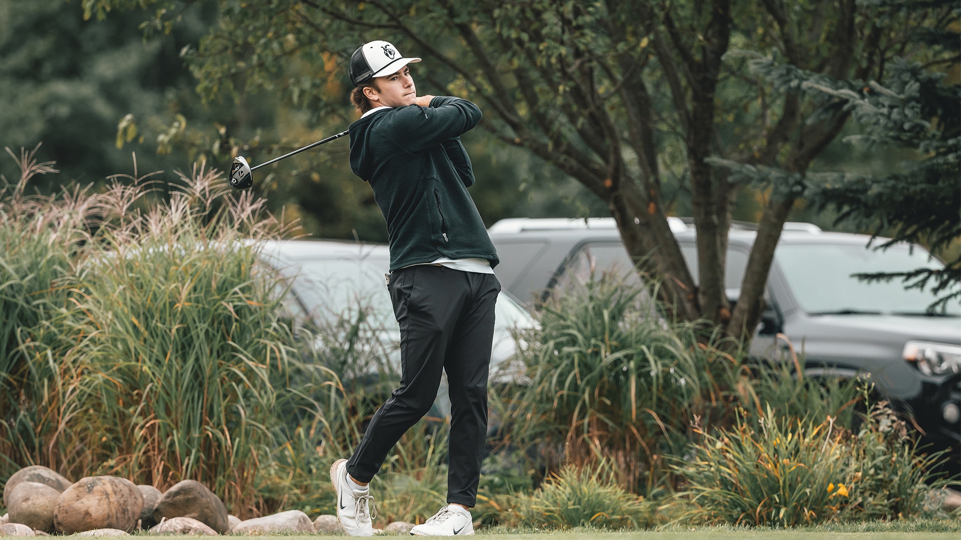 Matthew Unger taking a swing on the tee box.
