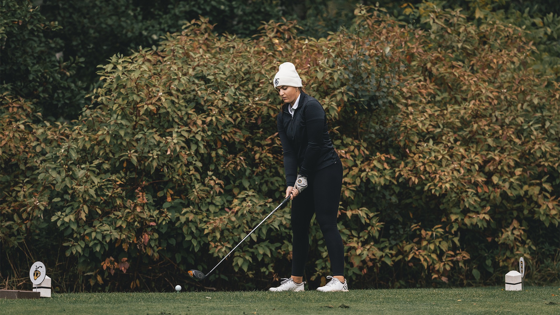 Sophia Otto lining up her tee shot.