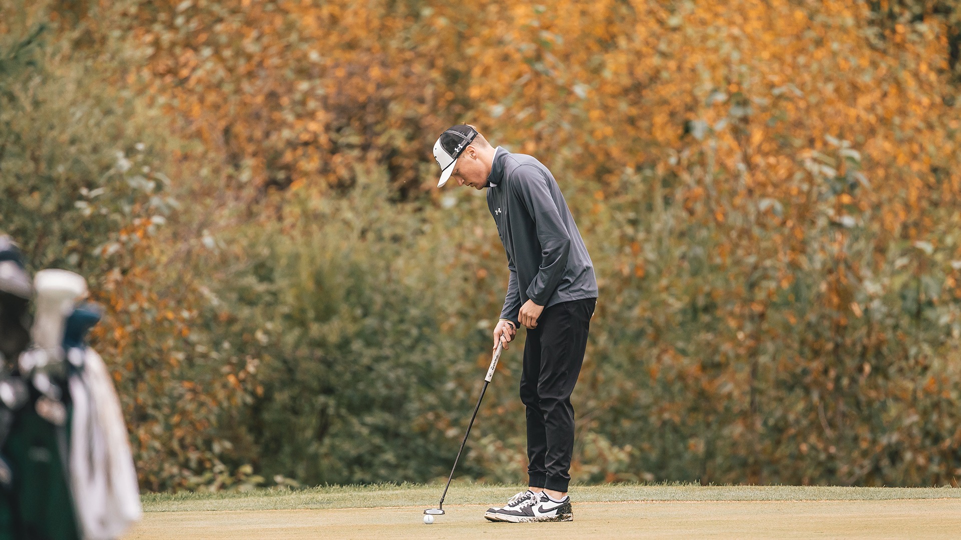 JD Glampe lining up his putt.