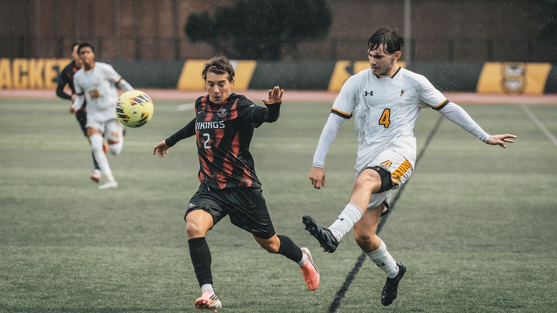 Adam Kaffel sending the ball past a defender.
