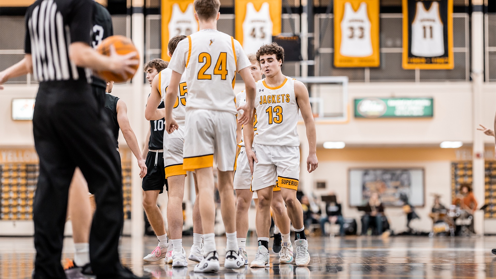 Gage Braiedy next to his teammates.