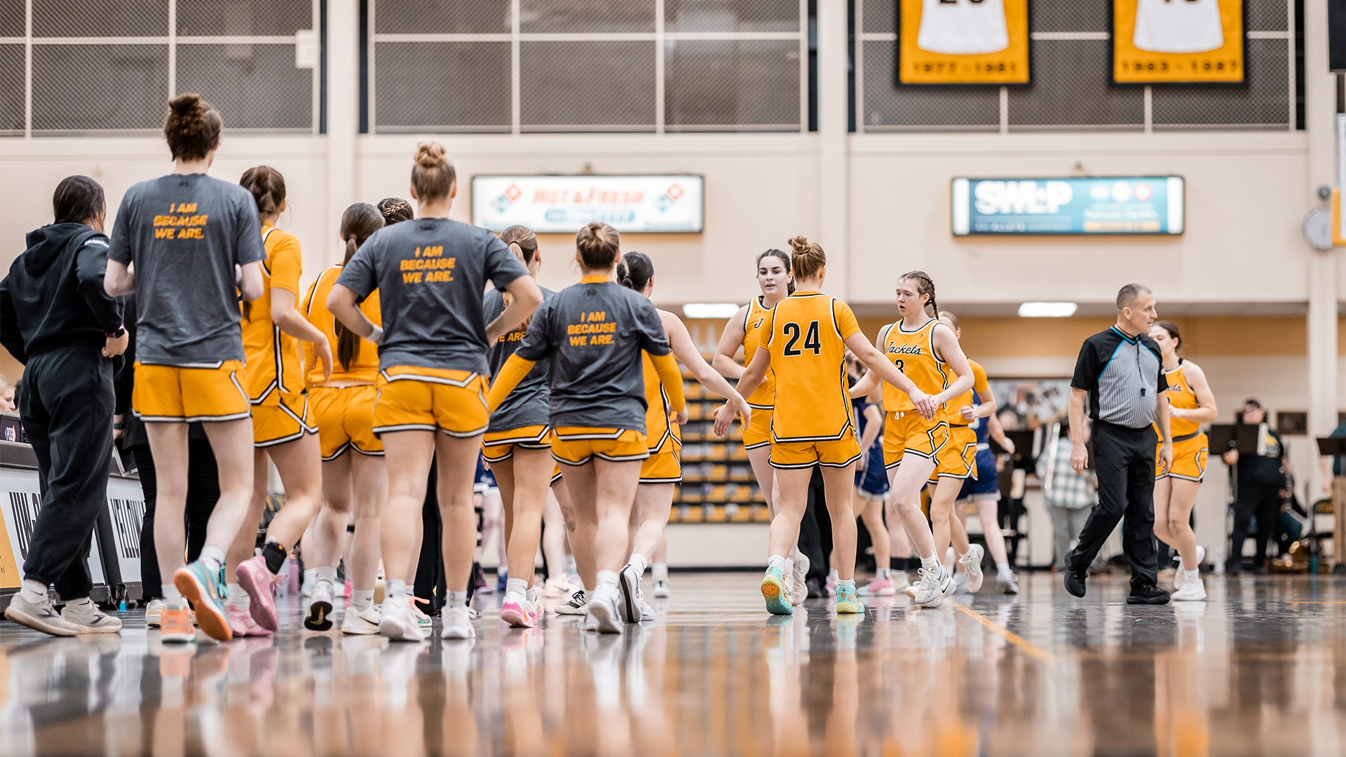 The Yellowjacket bench greeting the starting five.