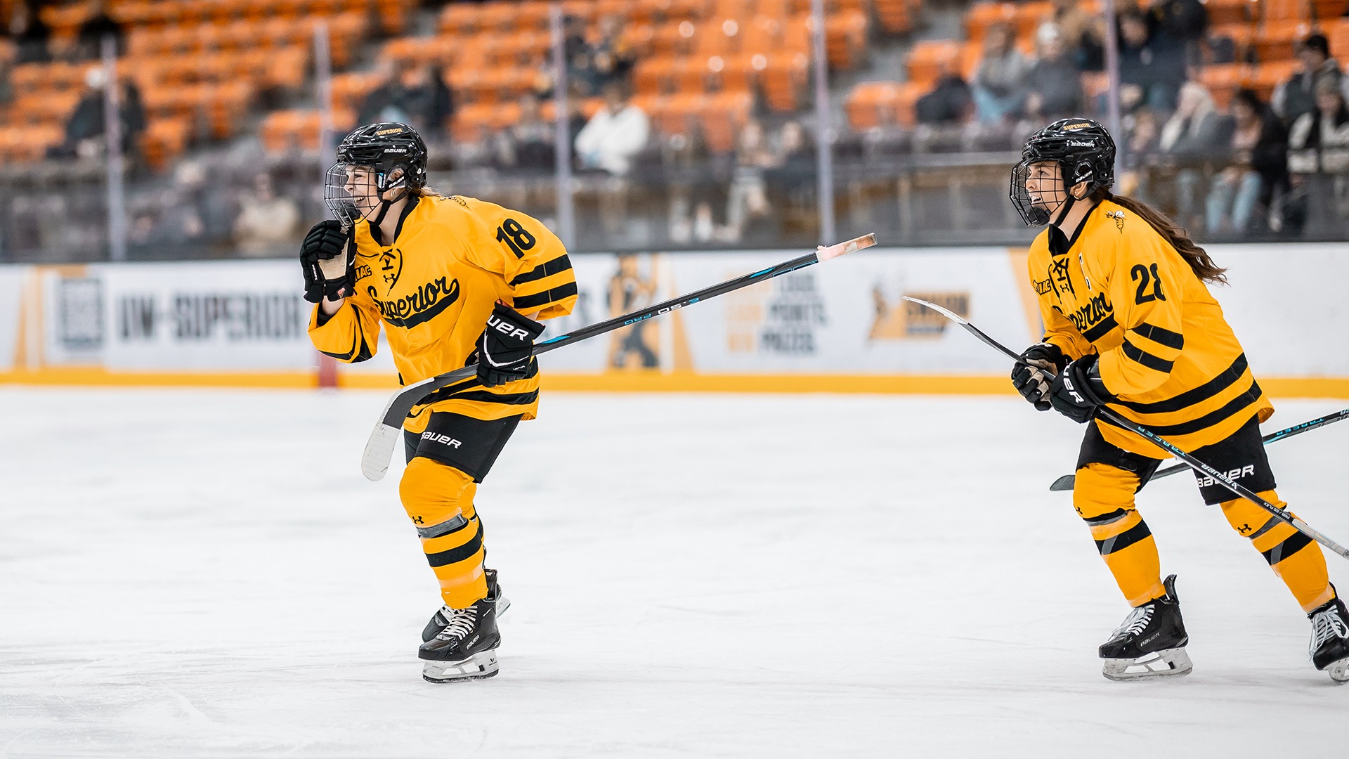 Kendal Gustavsson and Ashton Parnell skate back to the bench after a goal. 