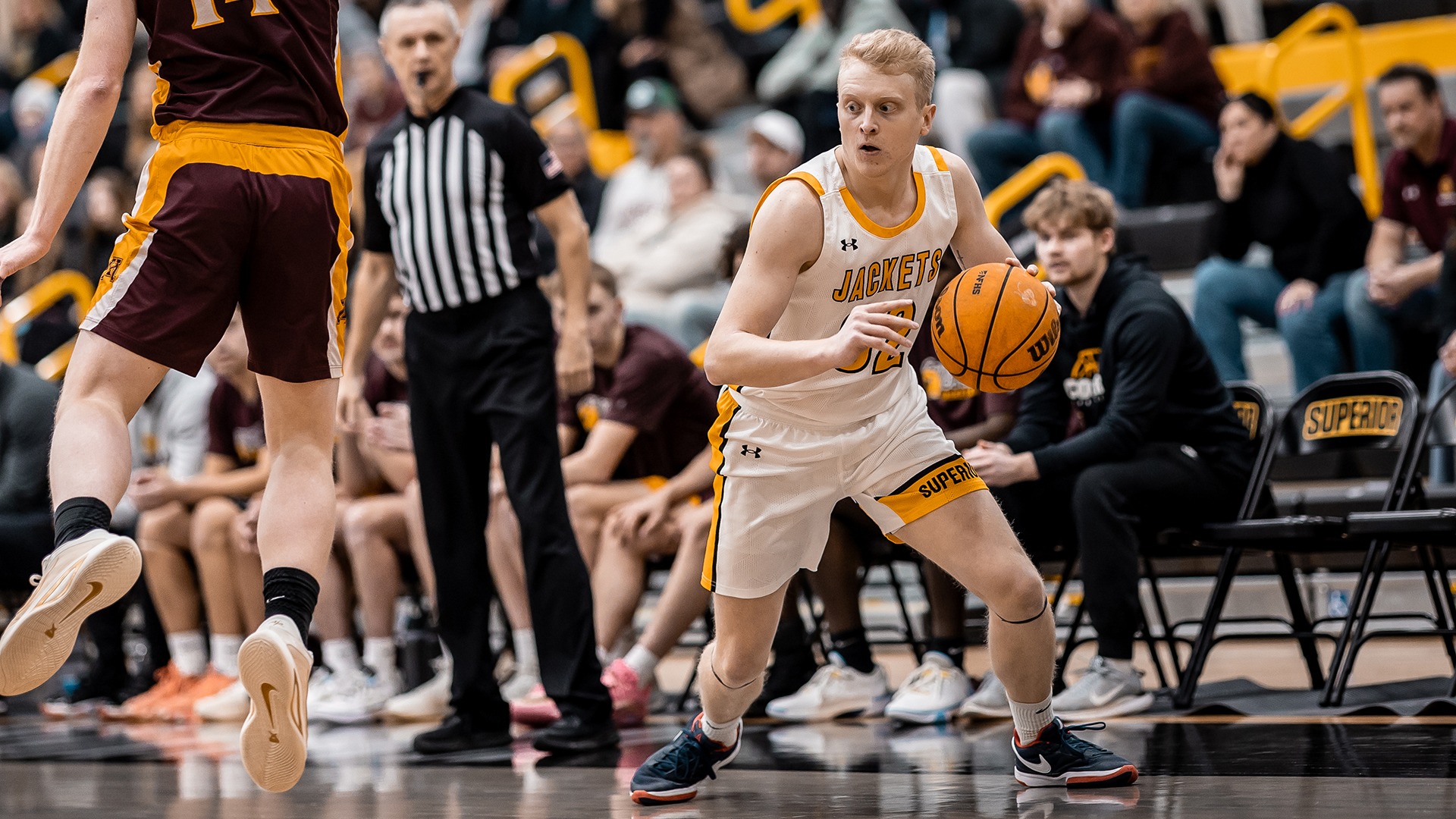 Jackson Allfrey drives past Minnesota Morris defender. 