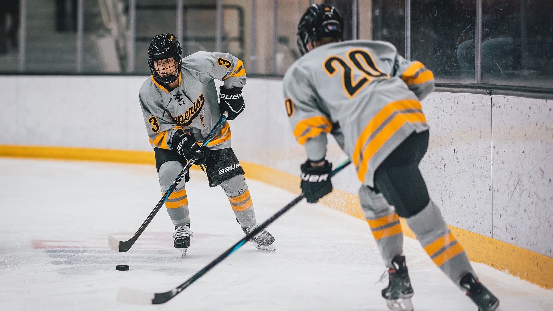 Kasja Kovala and Avery Olenik skating on the ice.
