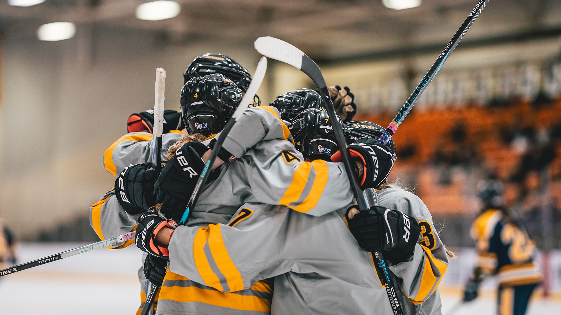 A group of Yellowjackets celebrate a goal. 