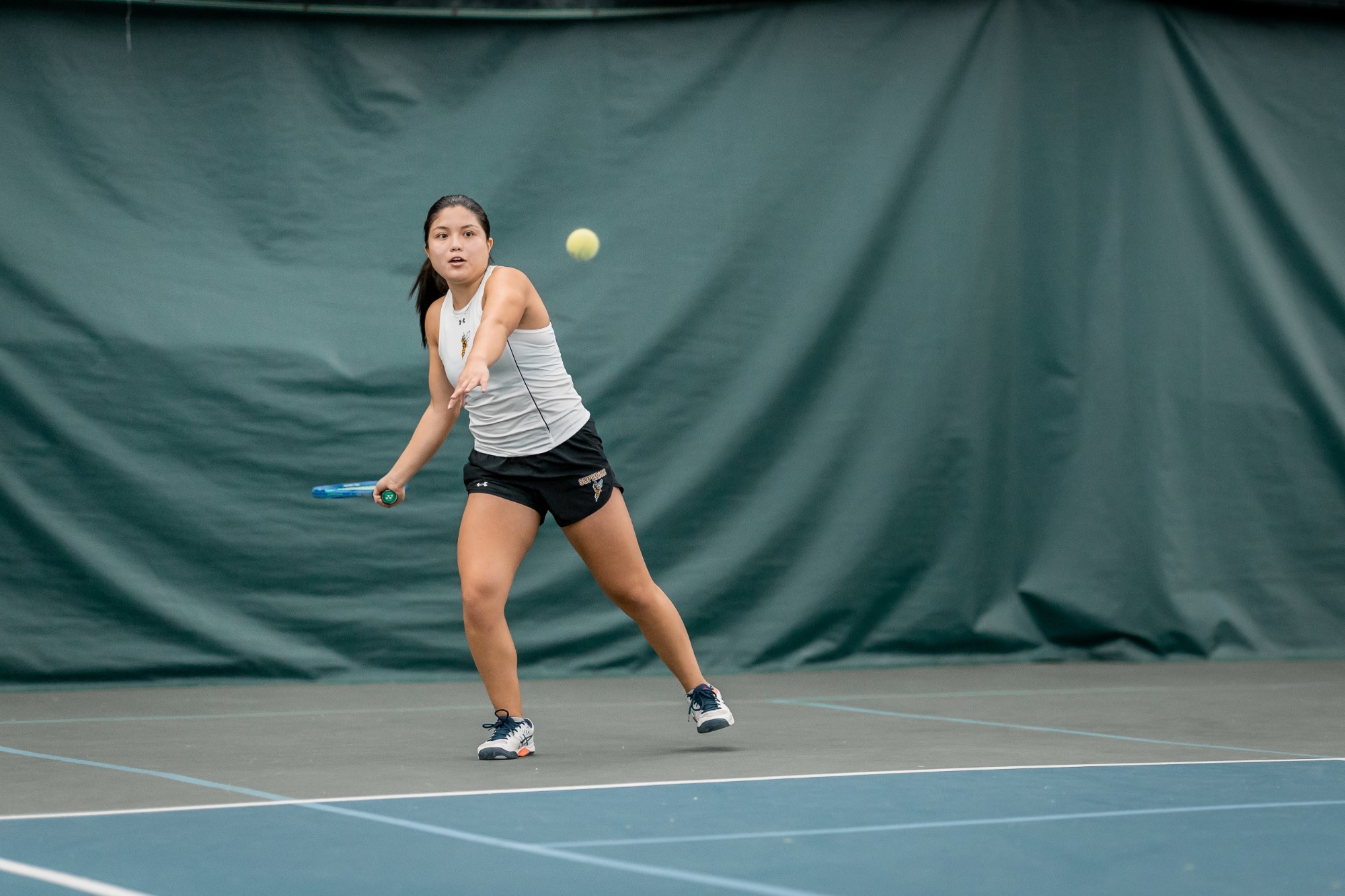 Andreina Tejada focuses on a ball.