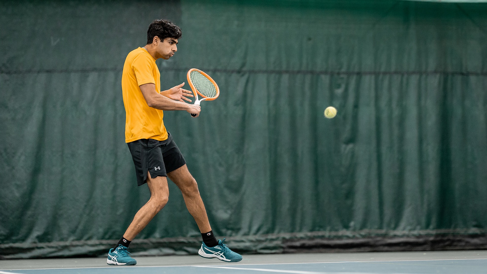 Yash Chhabra returns a ball. 
