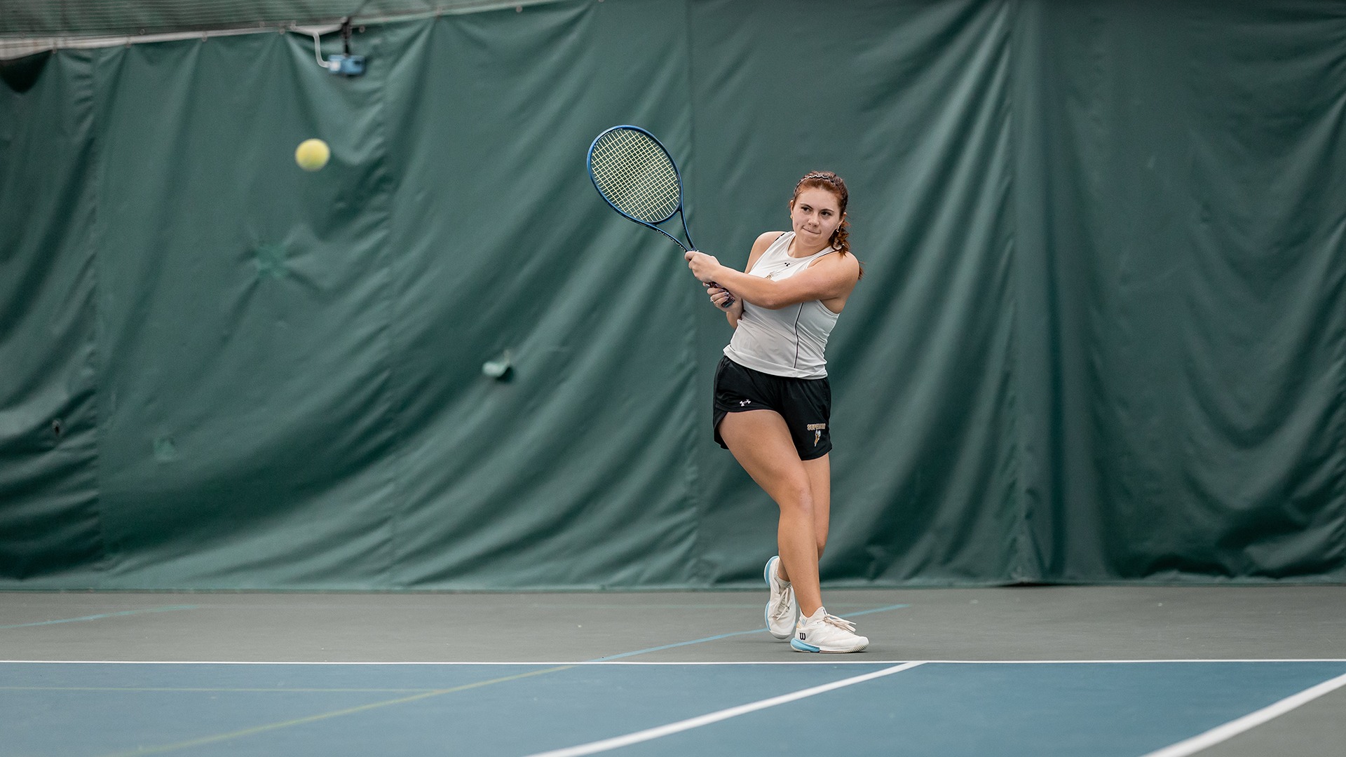 Claudia Curtis returns a ball. 