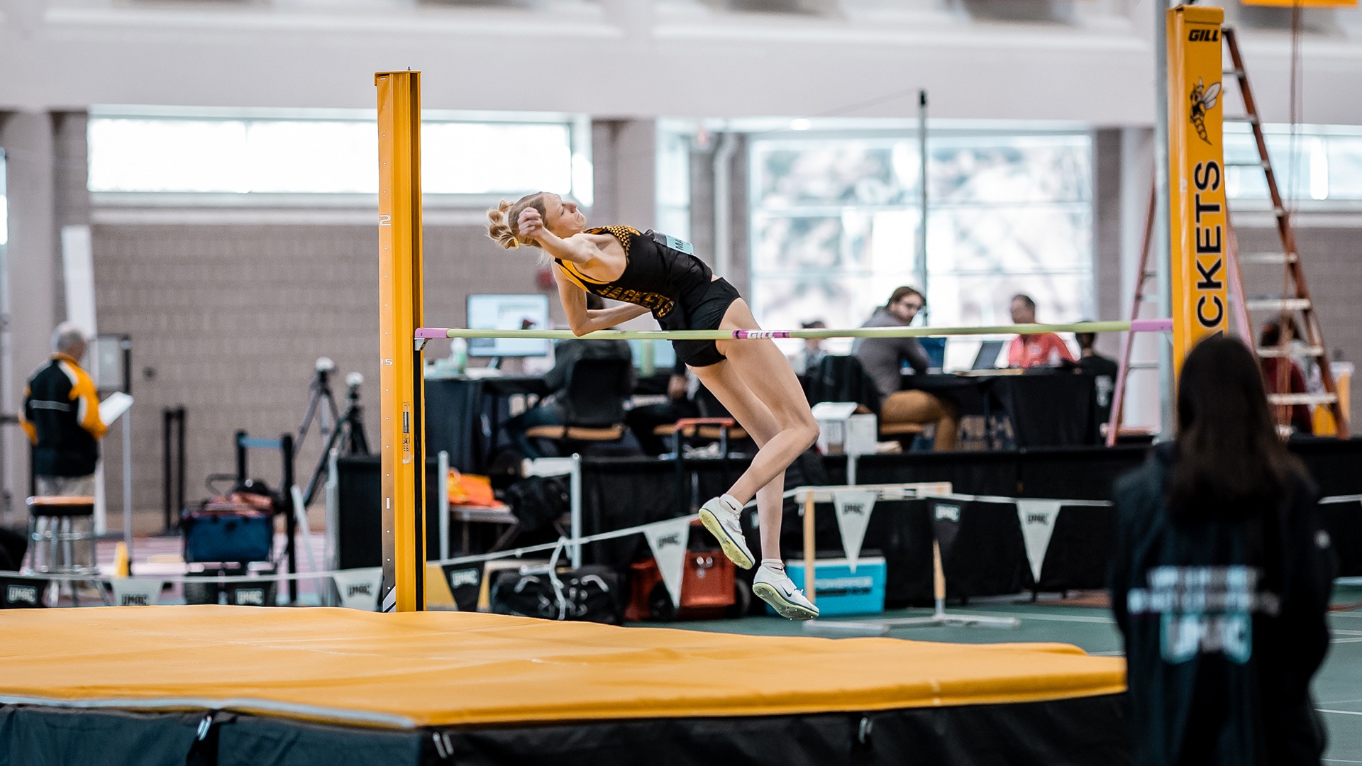 KelliJoy Manninen competing in the high jump.  