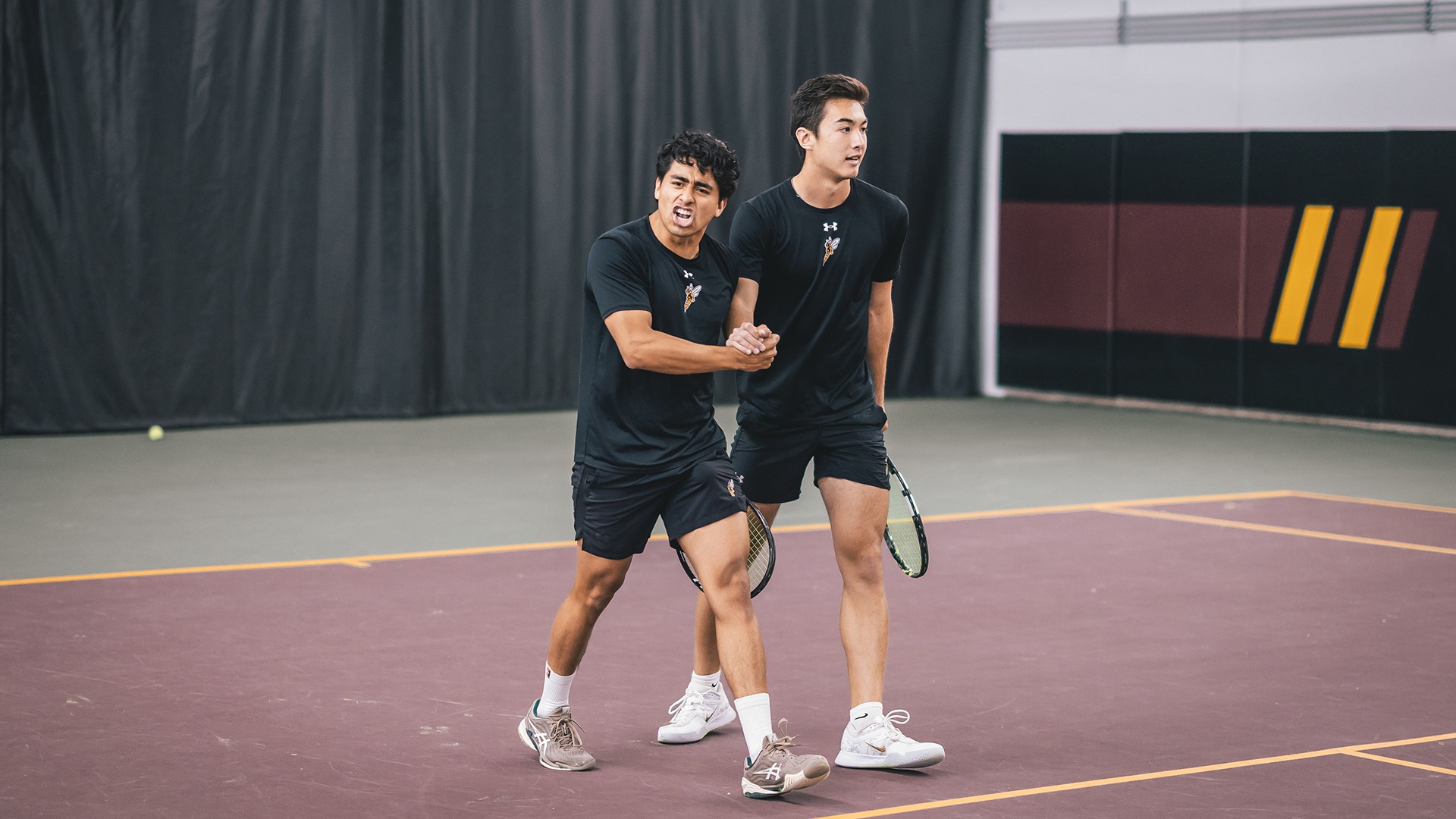 Mateo Abarca Pino and Keanu Lin celebrate after doubles win. 