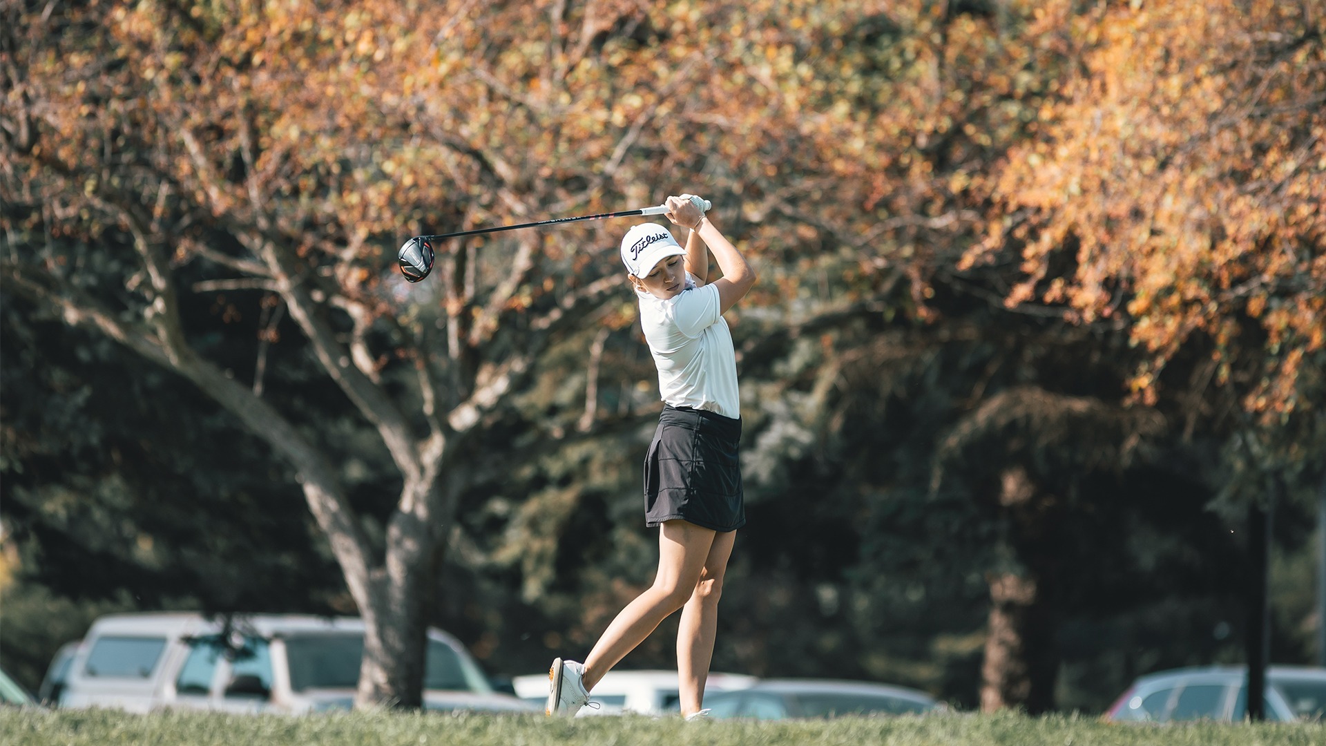 Olivia Weyenberg mid-swing on the tee box.