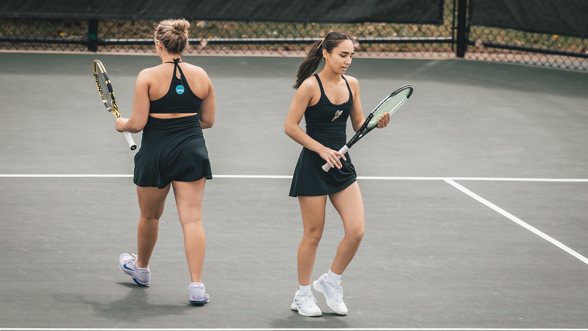 Elif Oezen and Addison Fee in doubles play.