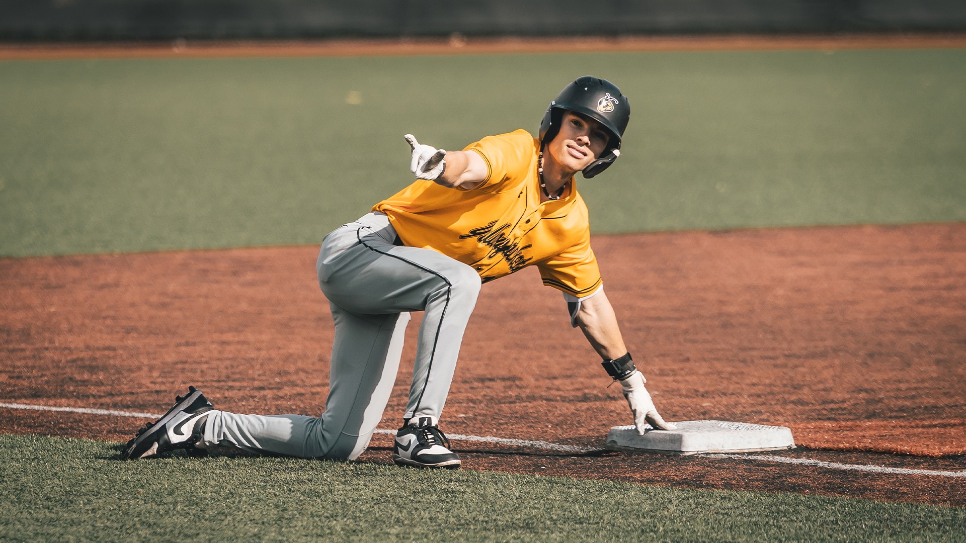 Carter Thielke celebrating at third base