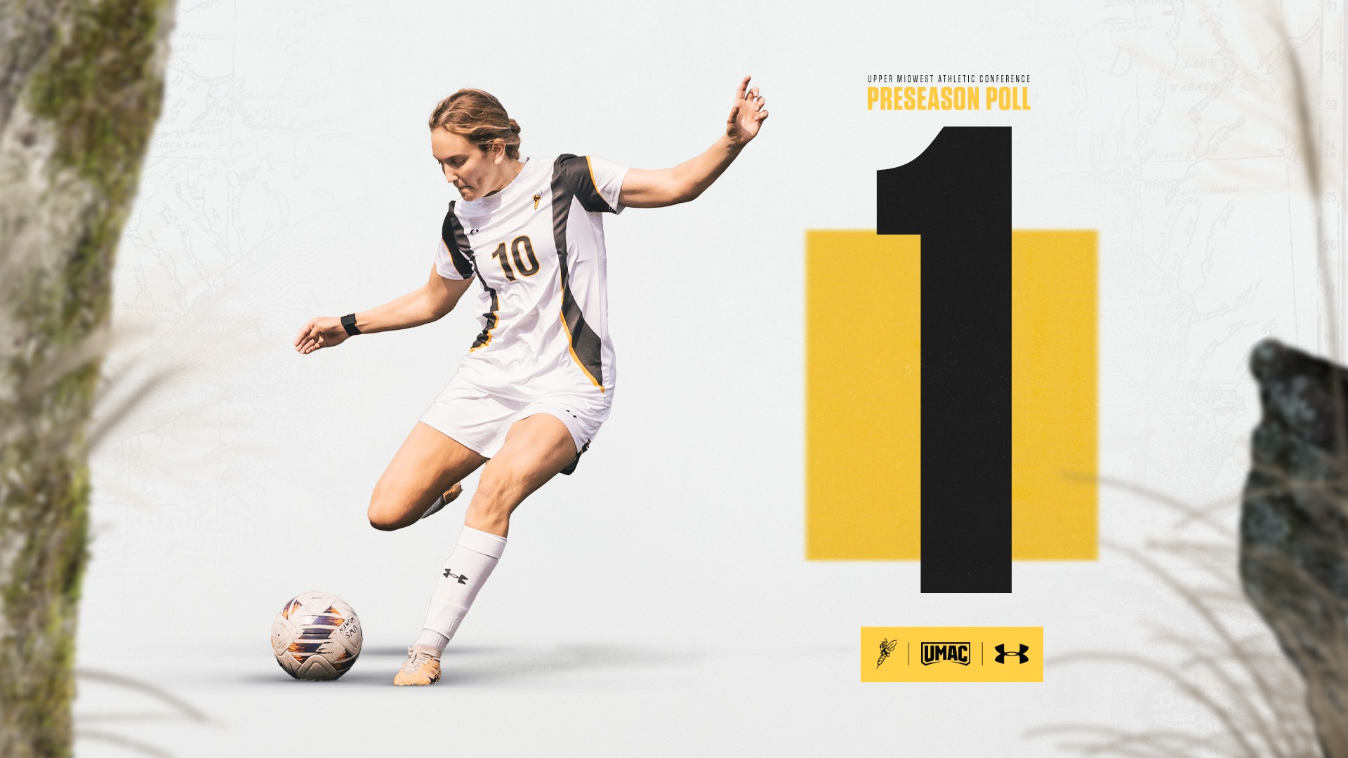A woman in a white uniform kicking a soccer ball next to a big yellow 