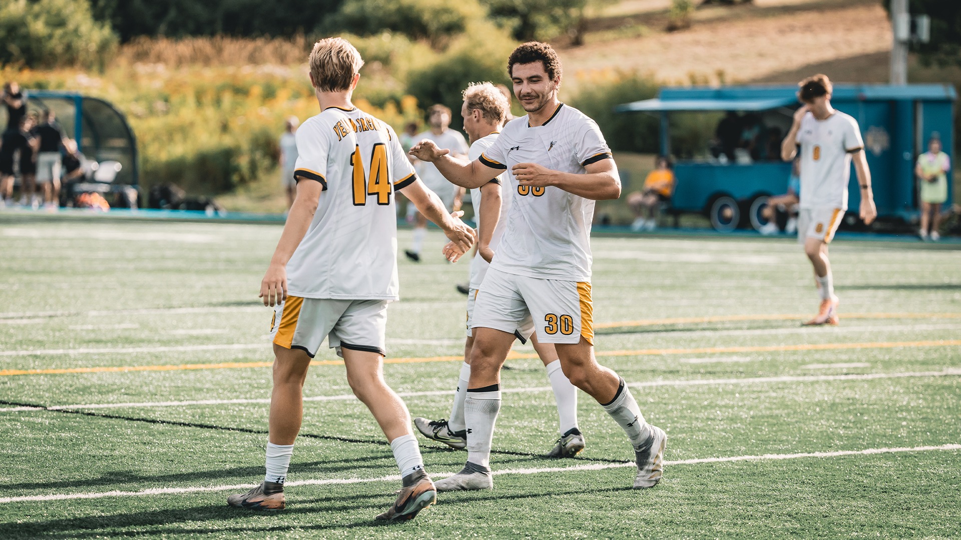 Seth Davidson and Bryce Boldt celebrating after a scored goal.