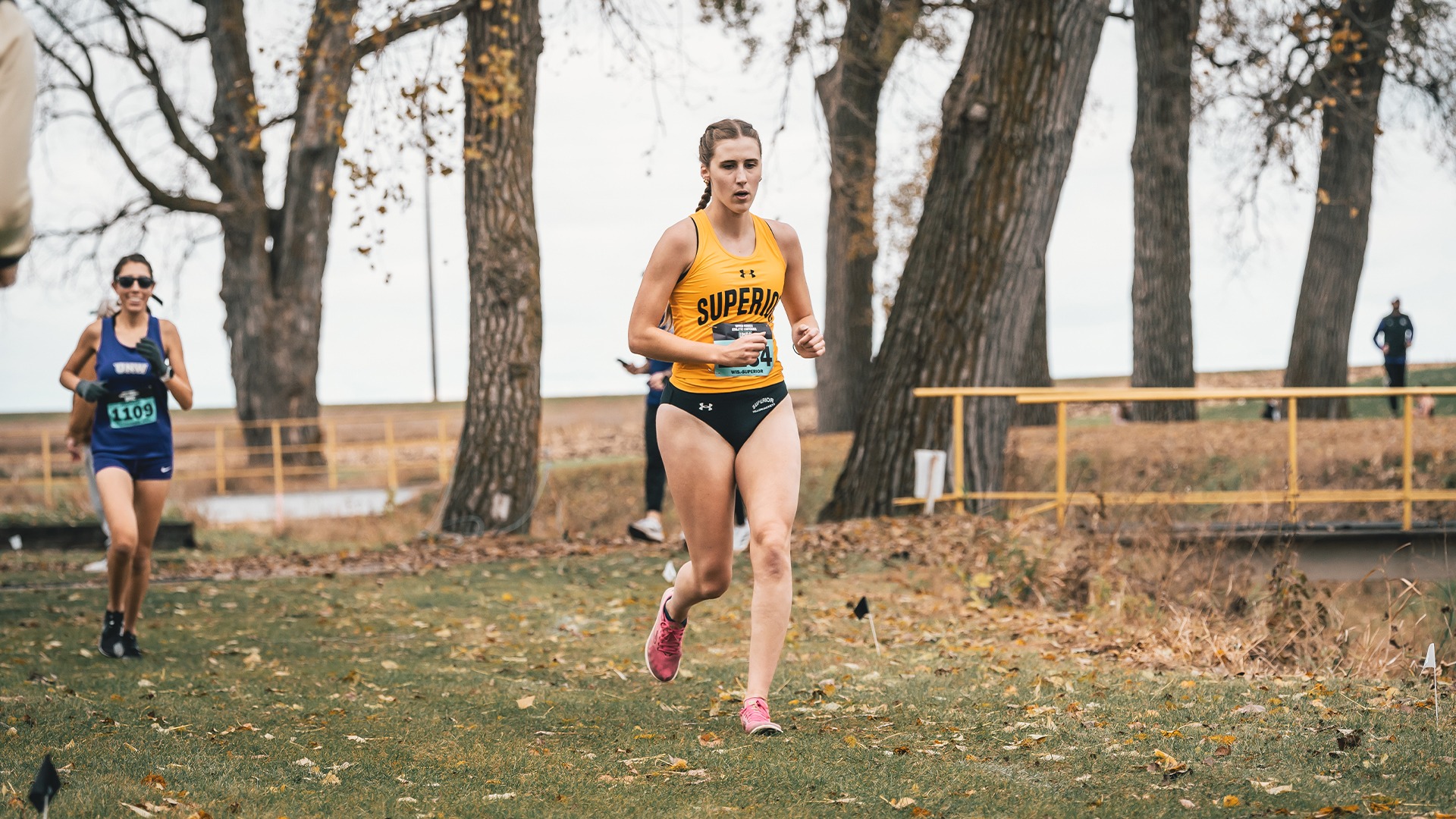 Amelia Olson mid-stride on the cross country track.