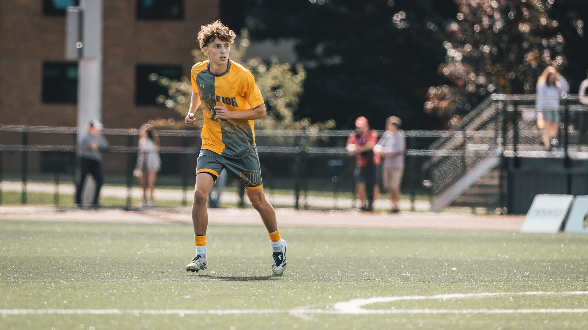 Alek Pyrah surveying the field during a soccer match.