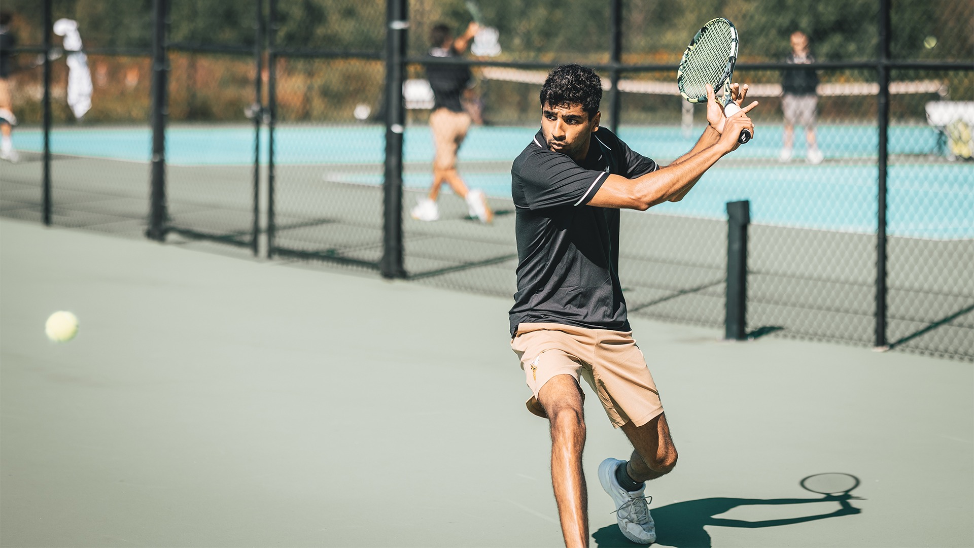 Yash Chhabra preparing to return a backhand shot.