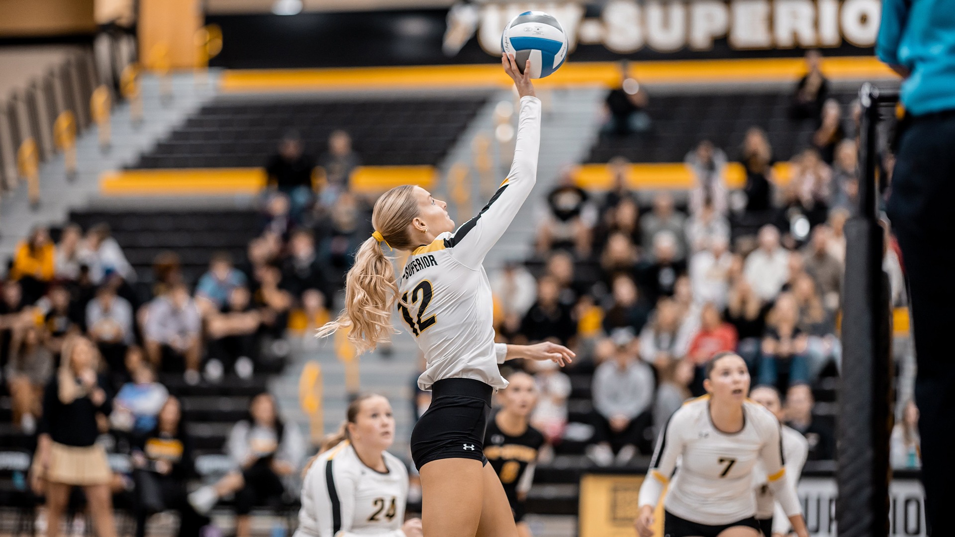 Kate Jamtgaard attempting a tip on the court.