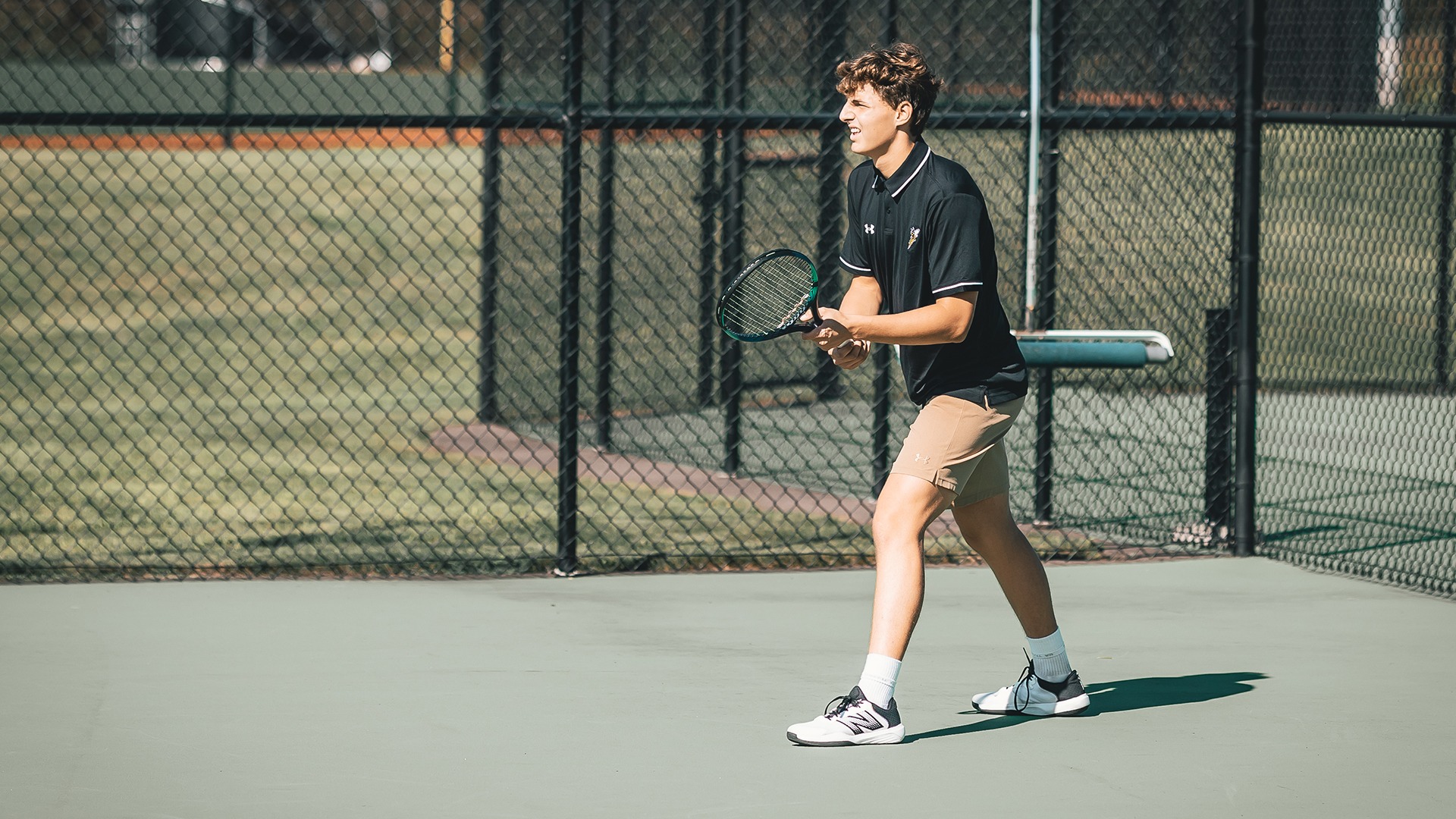 Andrei Rivera preparing to receive a serve.