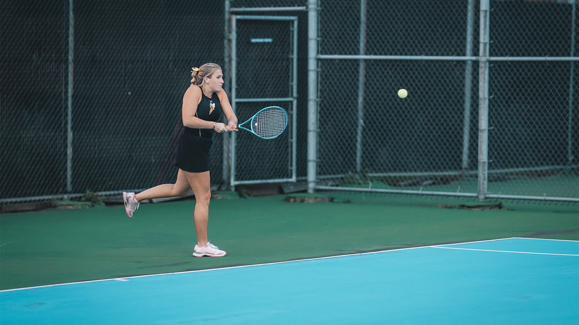 Emma LaPlante returning a backhanded shot.