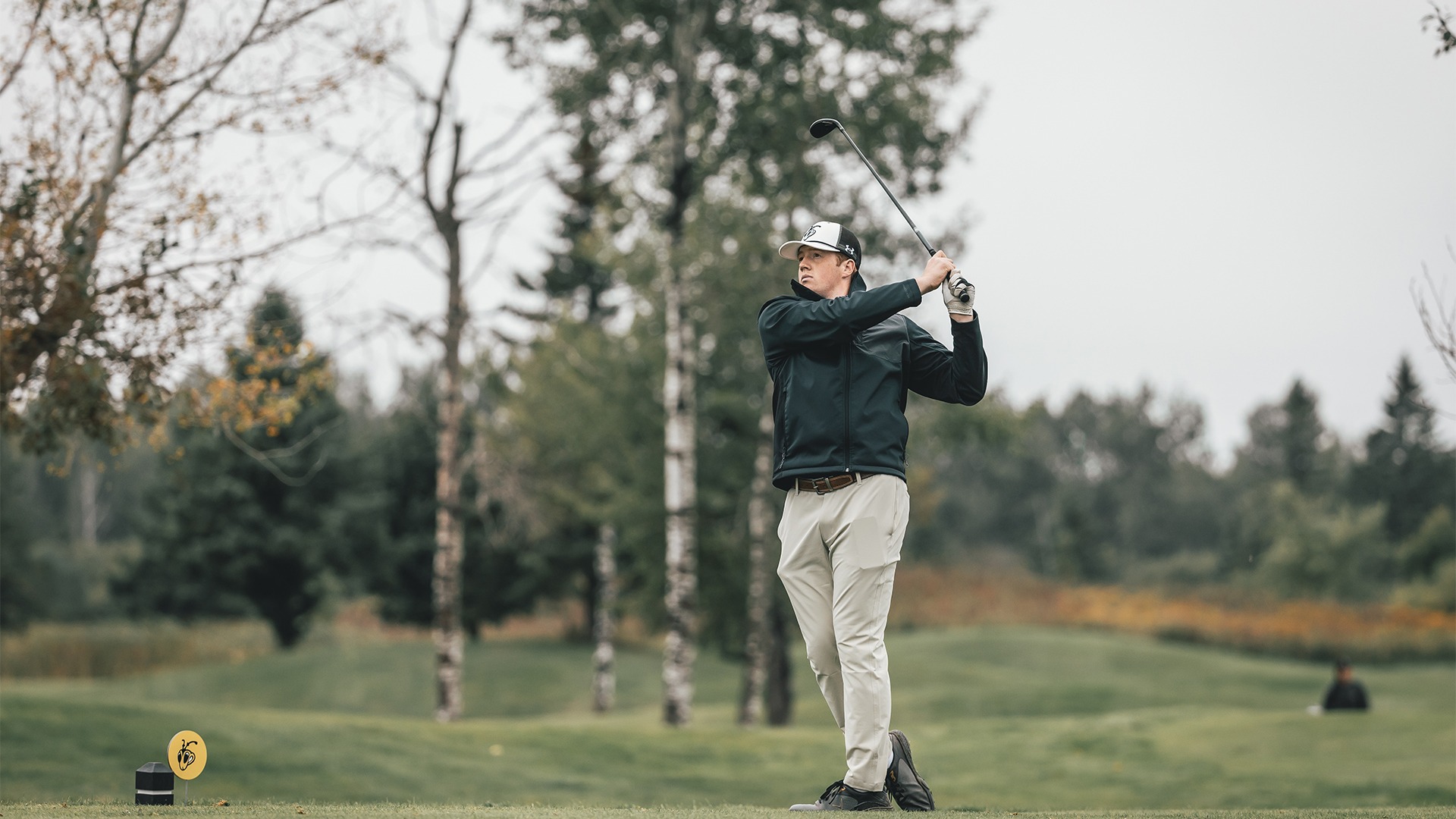 Noah Bourque on his follow through after a tee shot.