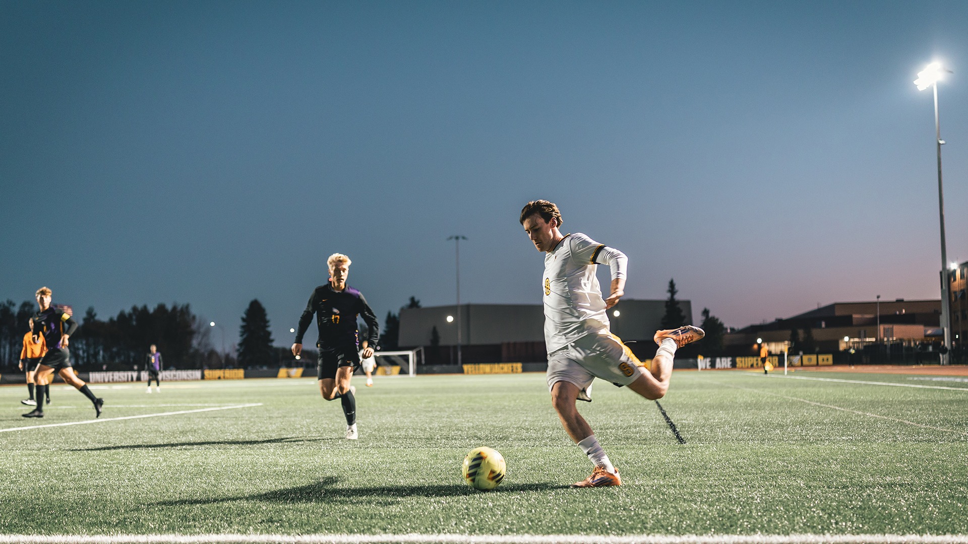 Harvey McLoughlin preparing to cross a ball into the box.