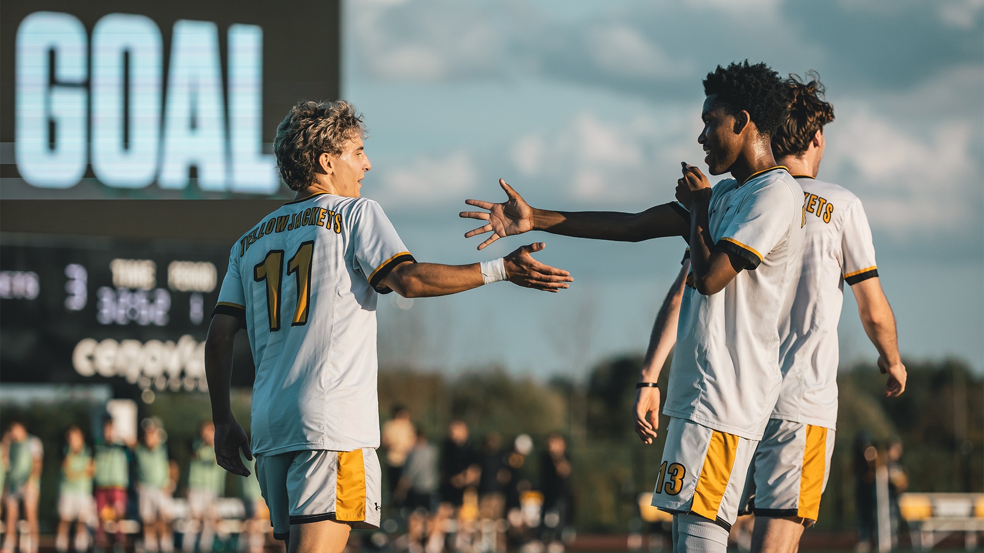 Jay'ce Jones and Valentin Soares sharing a high five after a goal.
