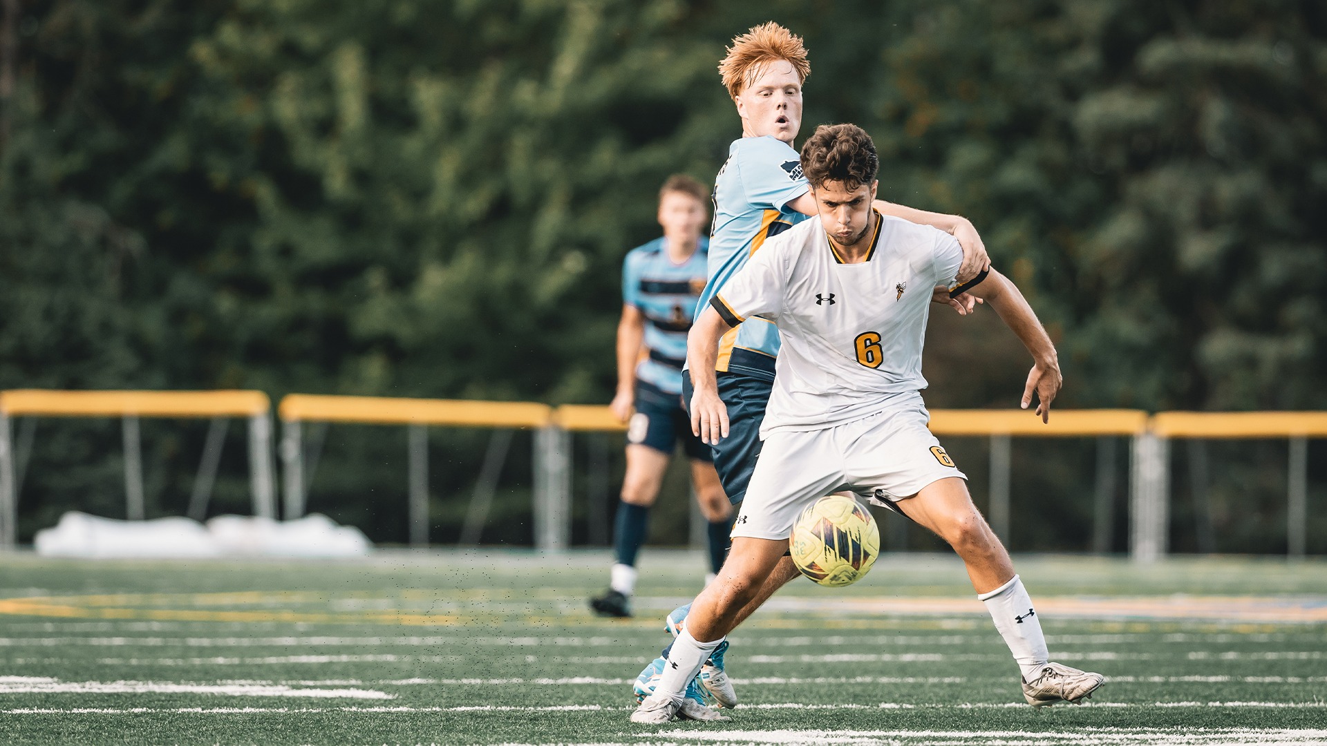 Orlando Fertleman collecting a ball from a defender.