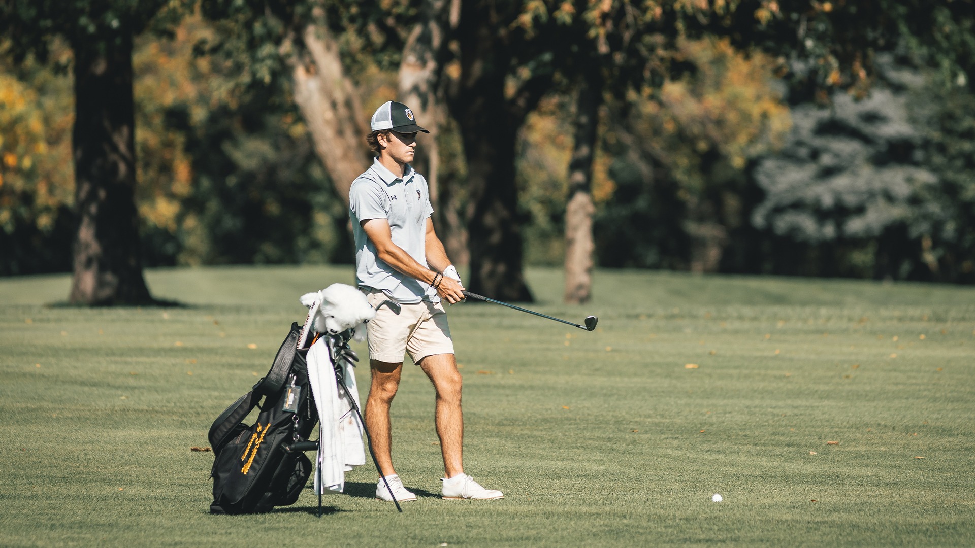 Matthew Unger prepares to hit a golf shot.