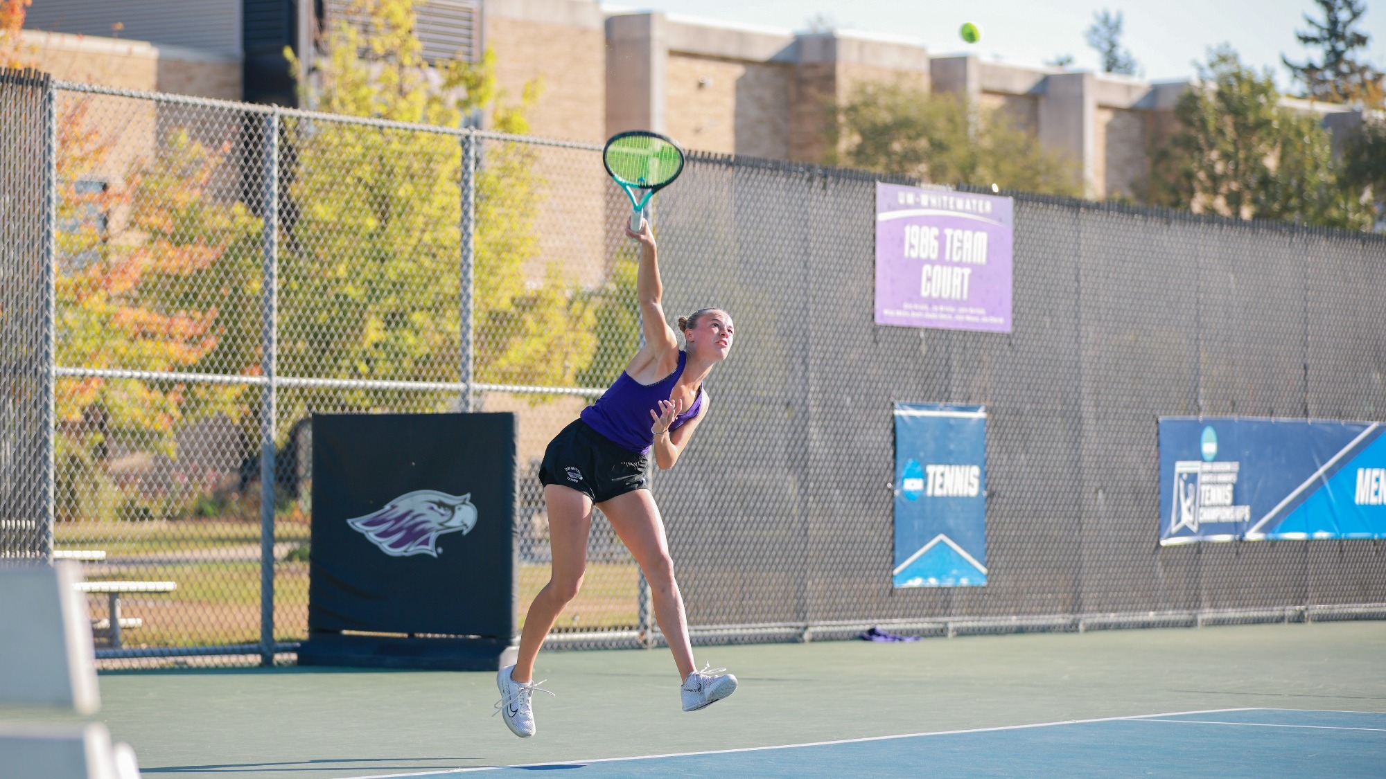 Warhawk tennis player serving