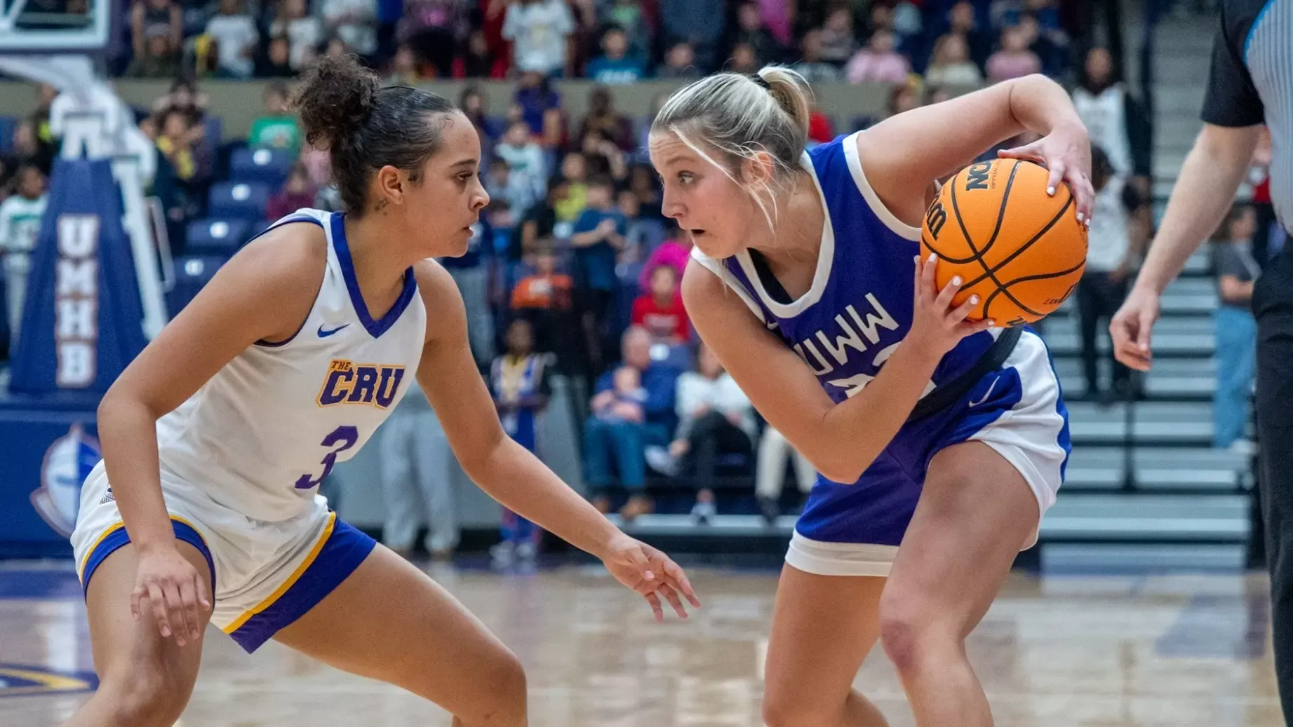 Cam Nies looks inside against UMHB