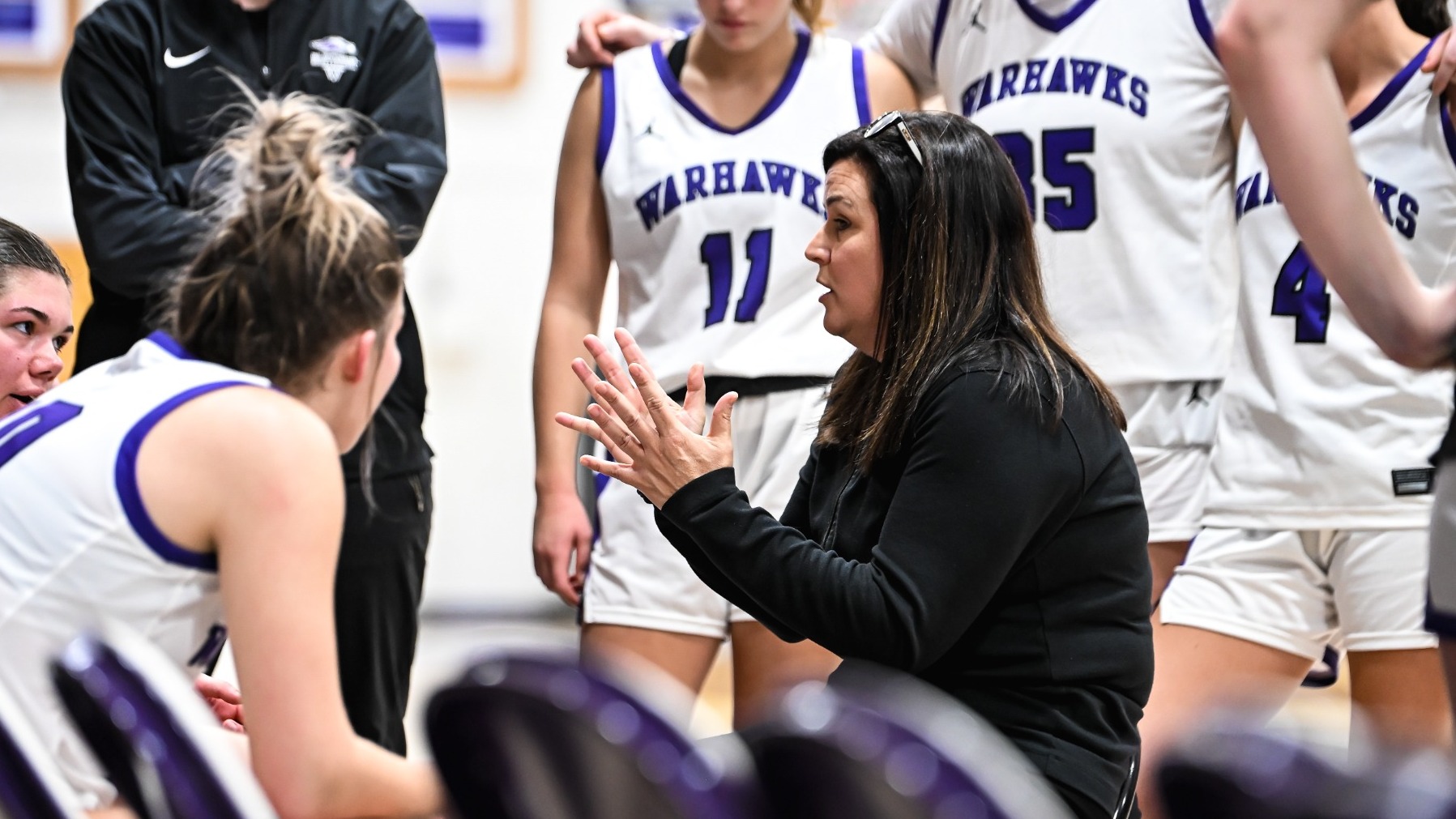 Keri Carollo action photo in huddle