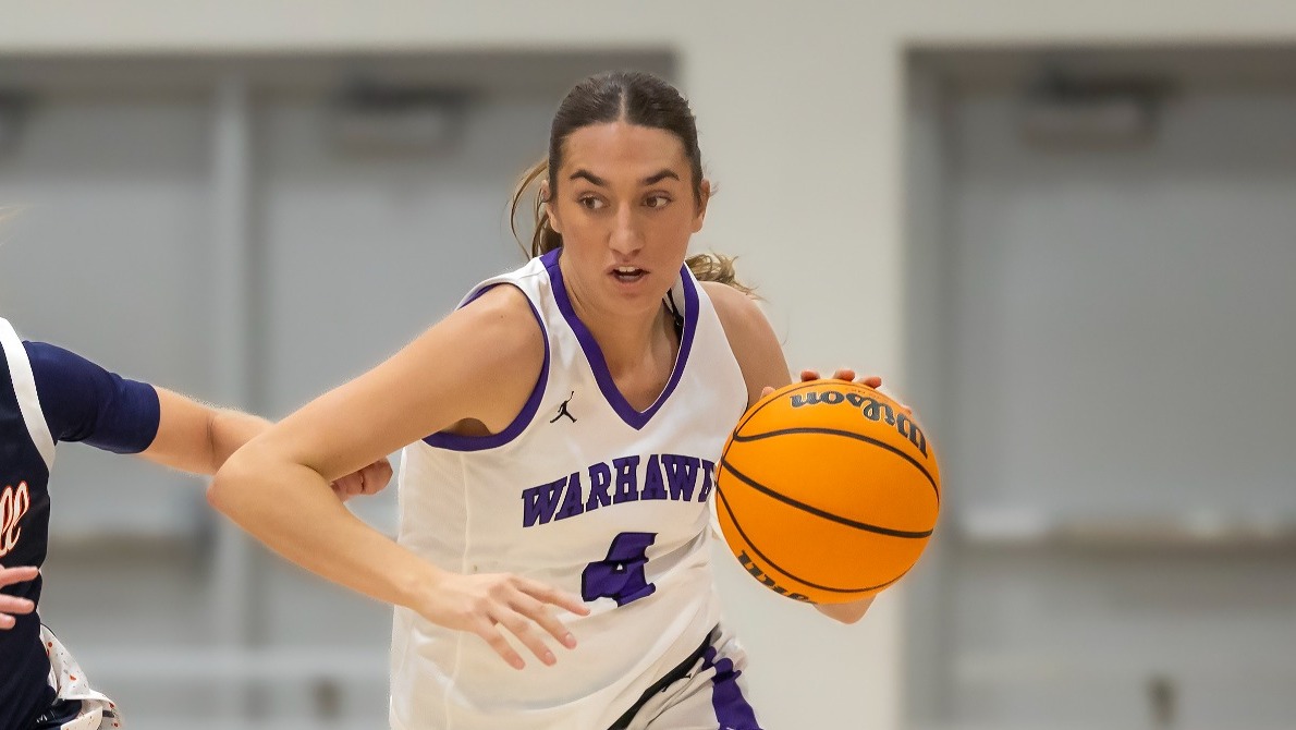Lainee Burks brings the ball up the court